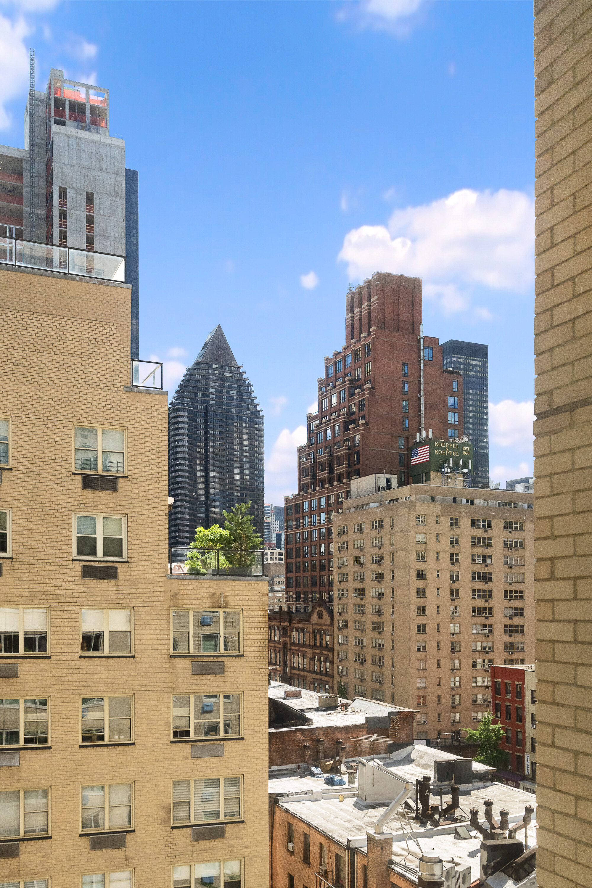 411 East 53rd Street, Unit 10E Manhattan, NY 10022 - Photo 7 of 8 a city view with tall buildings