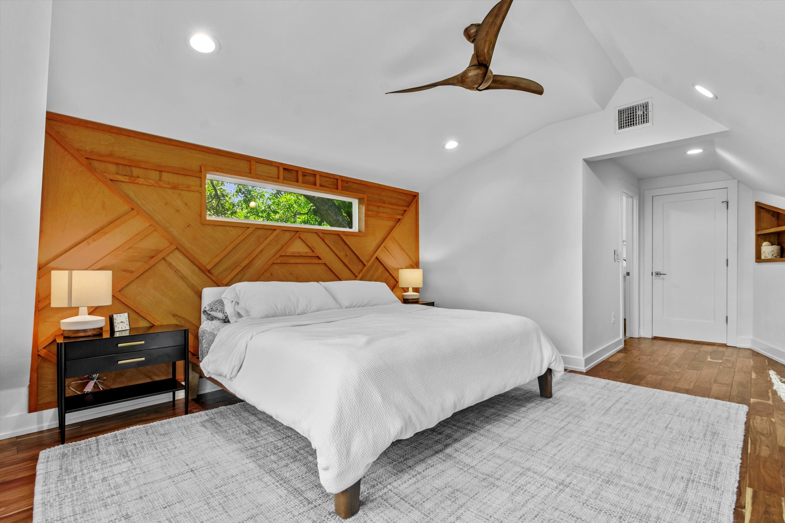 2712 Oak Springs Drive, Unit A Austin, TX 78702 - Photo 8 of 38 a bedroom with a bed and a painting on the wall