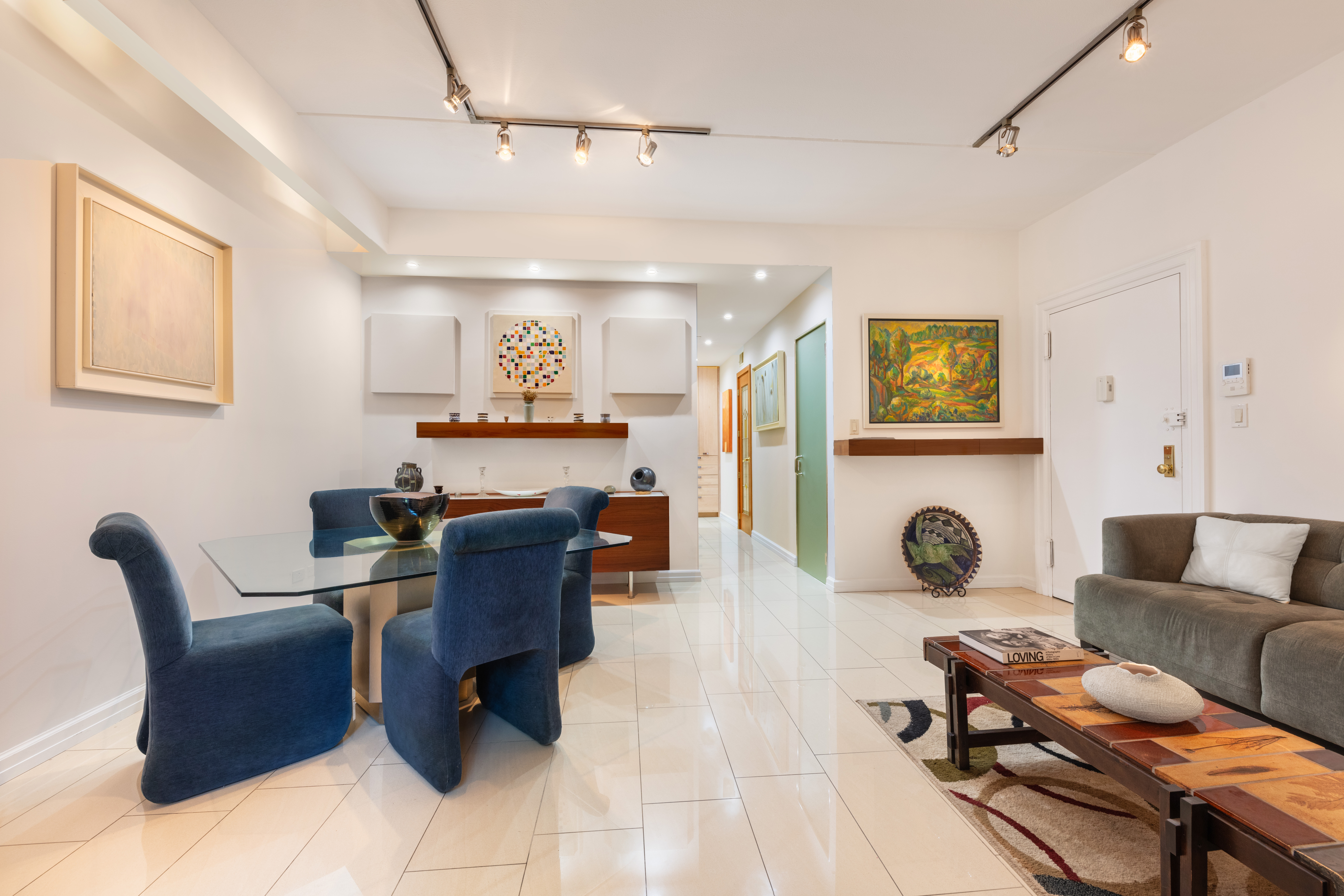 129 Barrow Street, Unit GA Manhattan, NY 10014 - Photo 2 of 17 a living room with furniture and a fireplace