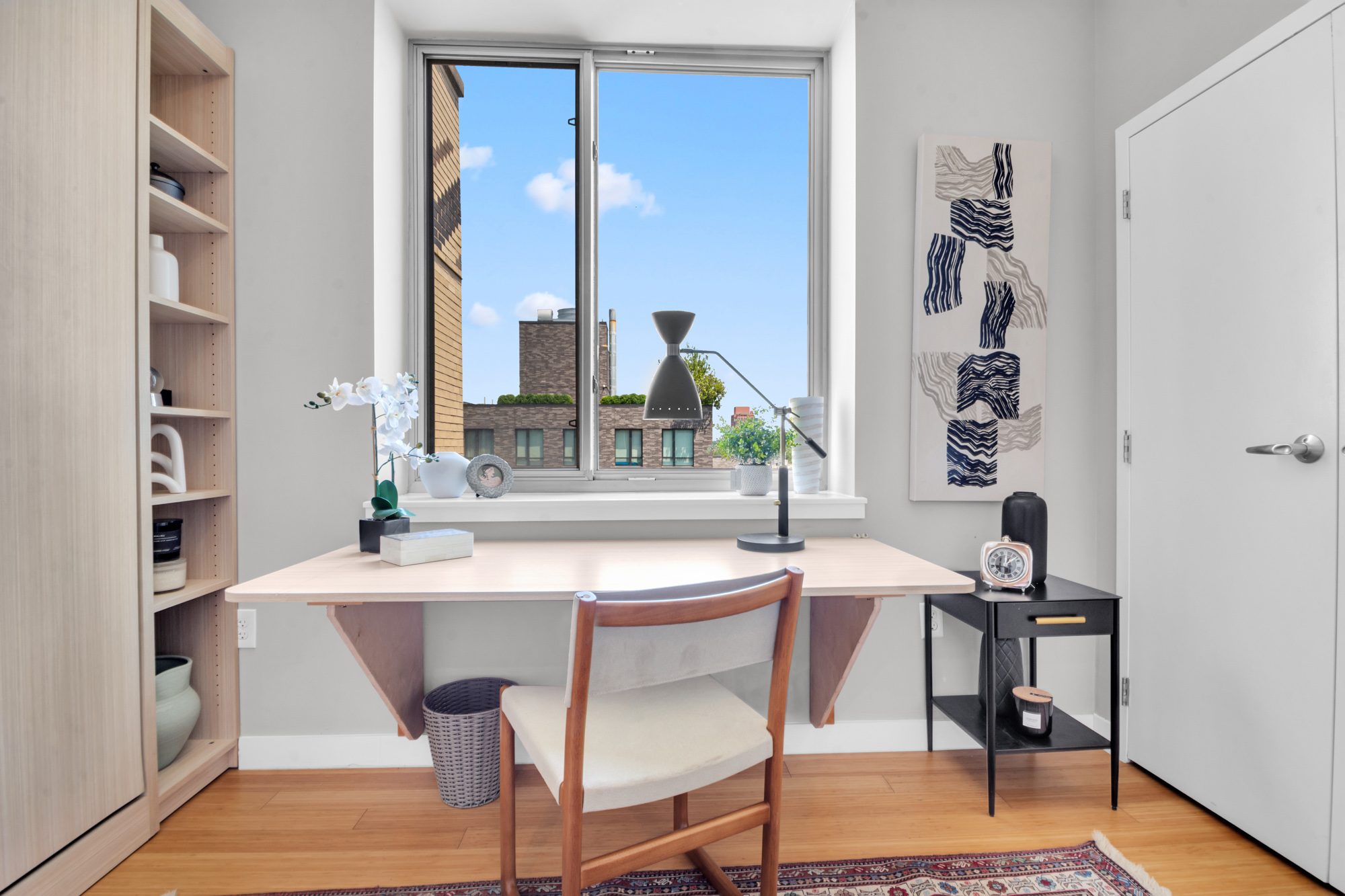 40 West 116th Street, Unit PHA1208 Manhattan, NY 10026 - Photo 11 of 28 a view of a dining room with furniture and a window