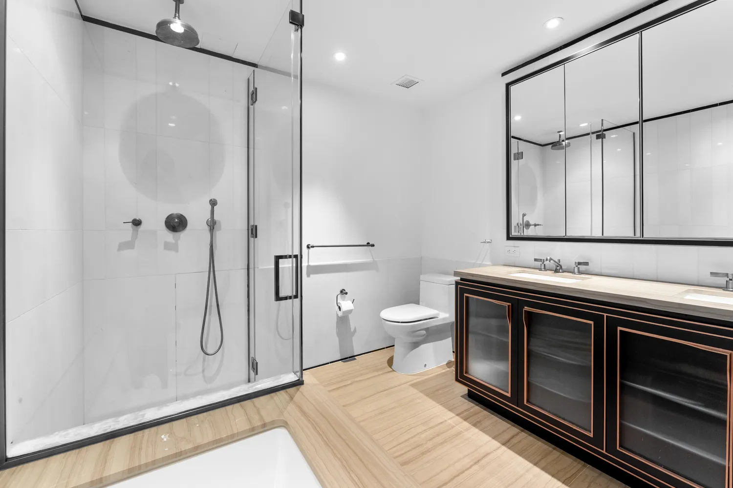 a bathroom with a sink a toilet and shower