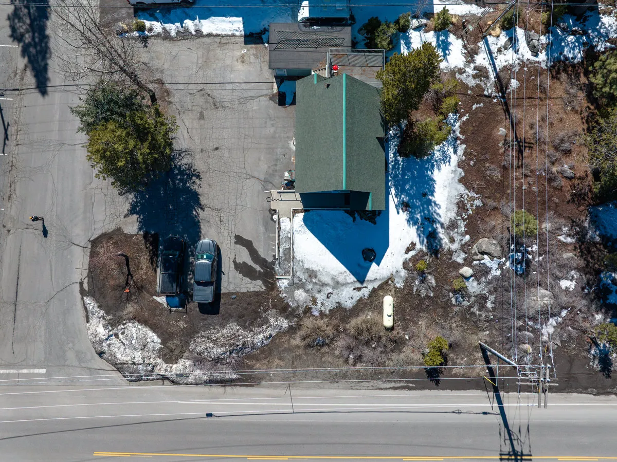 a view of a house with a yard and sitting area