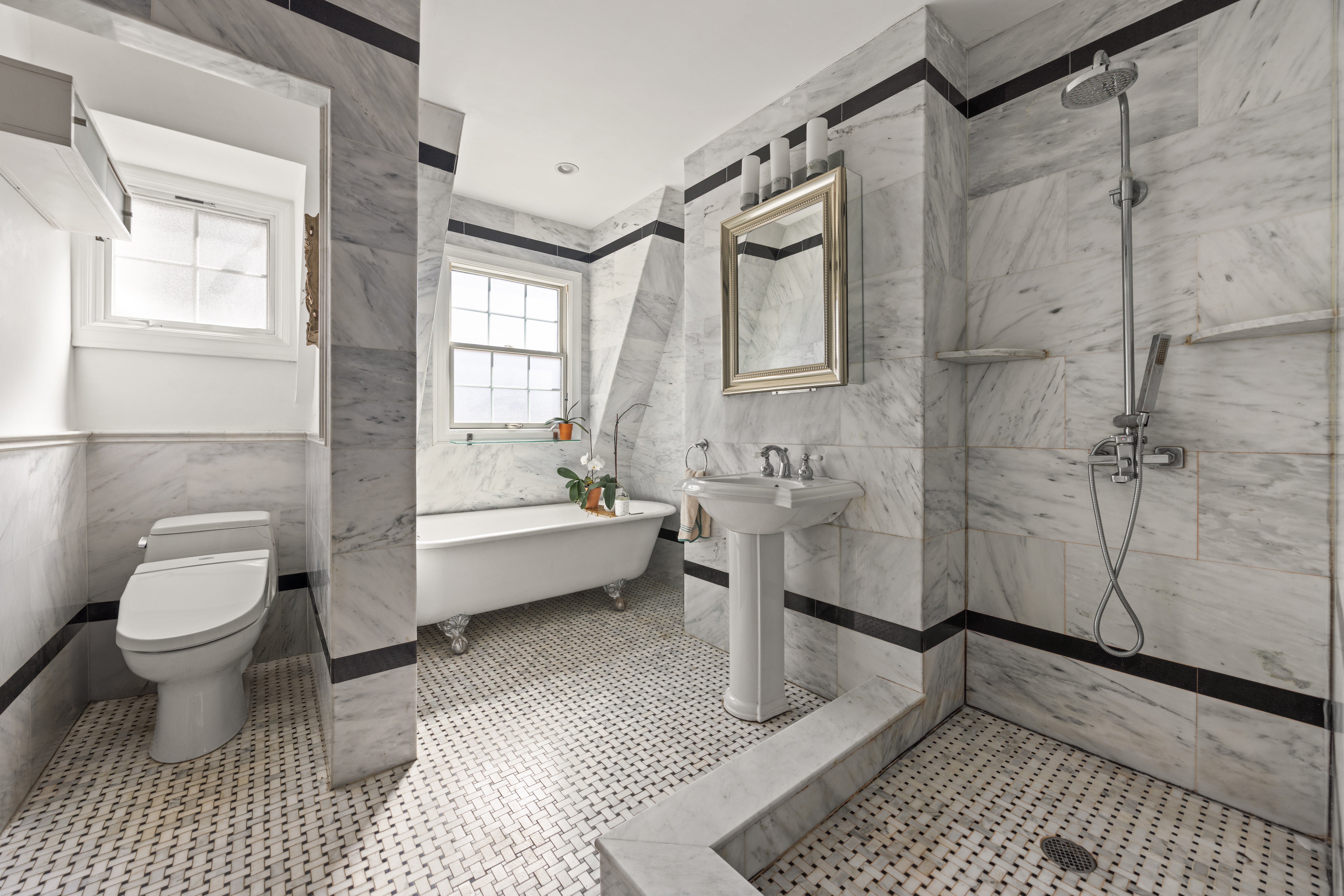 25 Chester Court Brooklyn, NY 11225 - Photo 14 of 17 a bathroom with a sink a toilet and shower