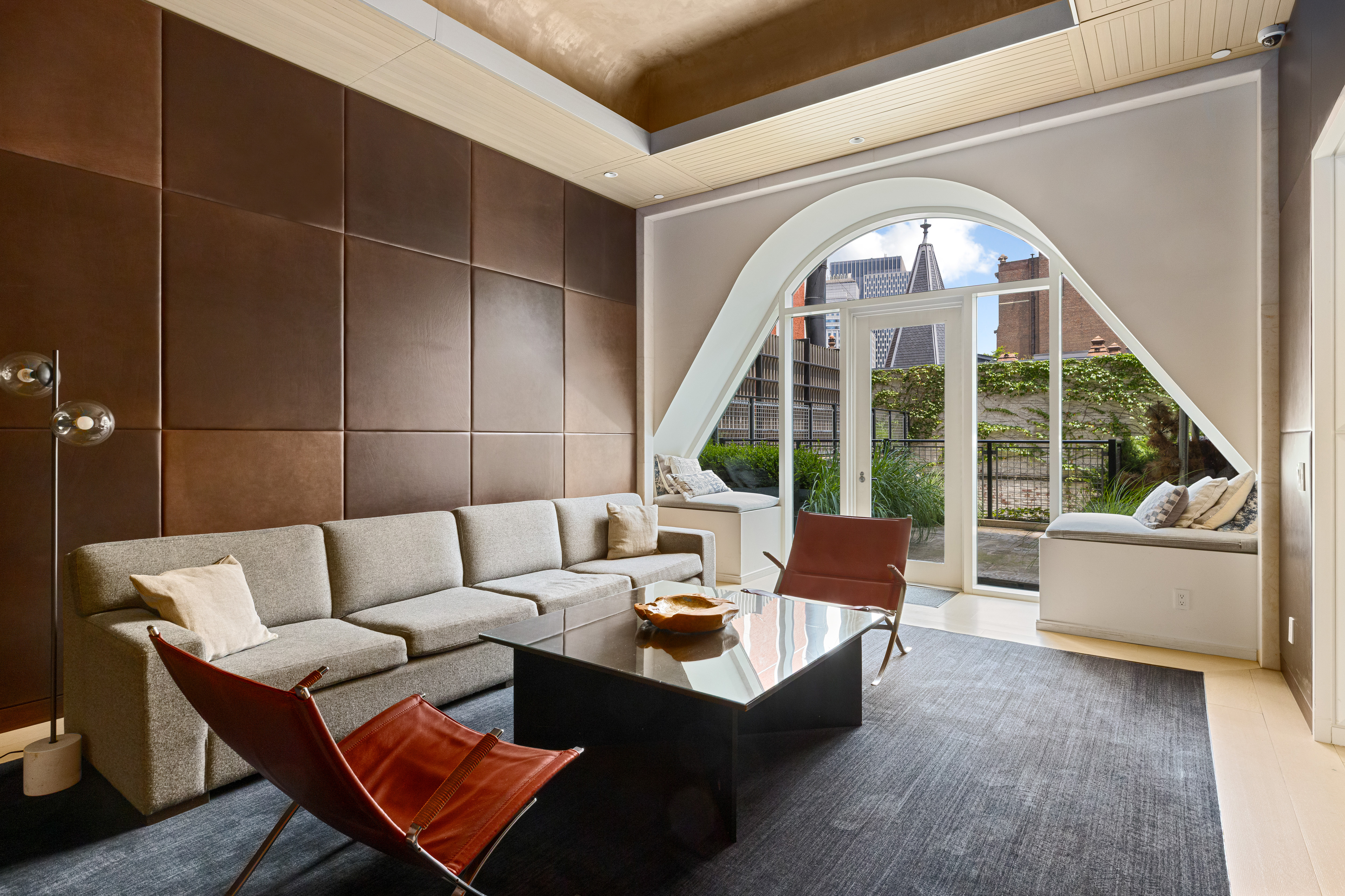 121 Nassau Street, Unit 17A Manhattan, NY 10038 - Photo 14 of 19 a living room with furniture and a large window