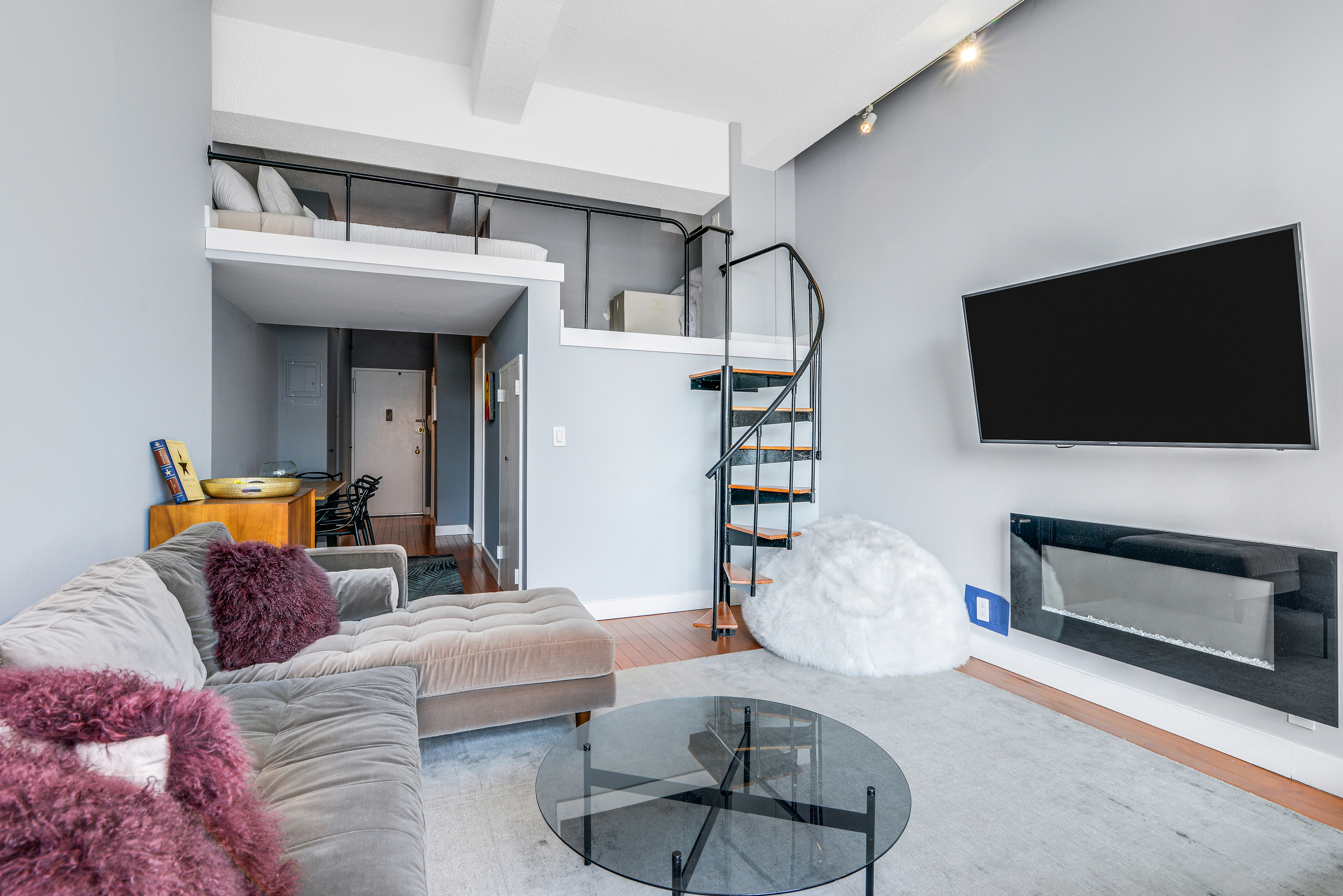 244 Madison Avenue, Unit 15J Manhattan, NY 10016 - Photo 4 of 11 a living room with furniture and a flat screen tv