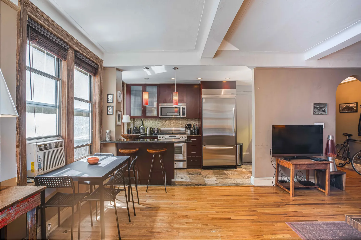a living room with furniture and a flat screen tv