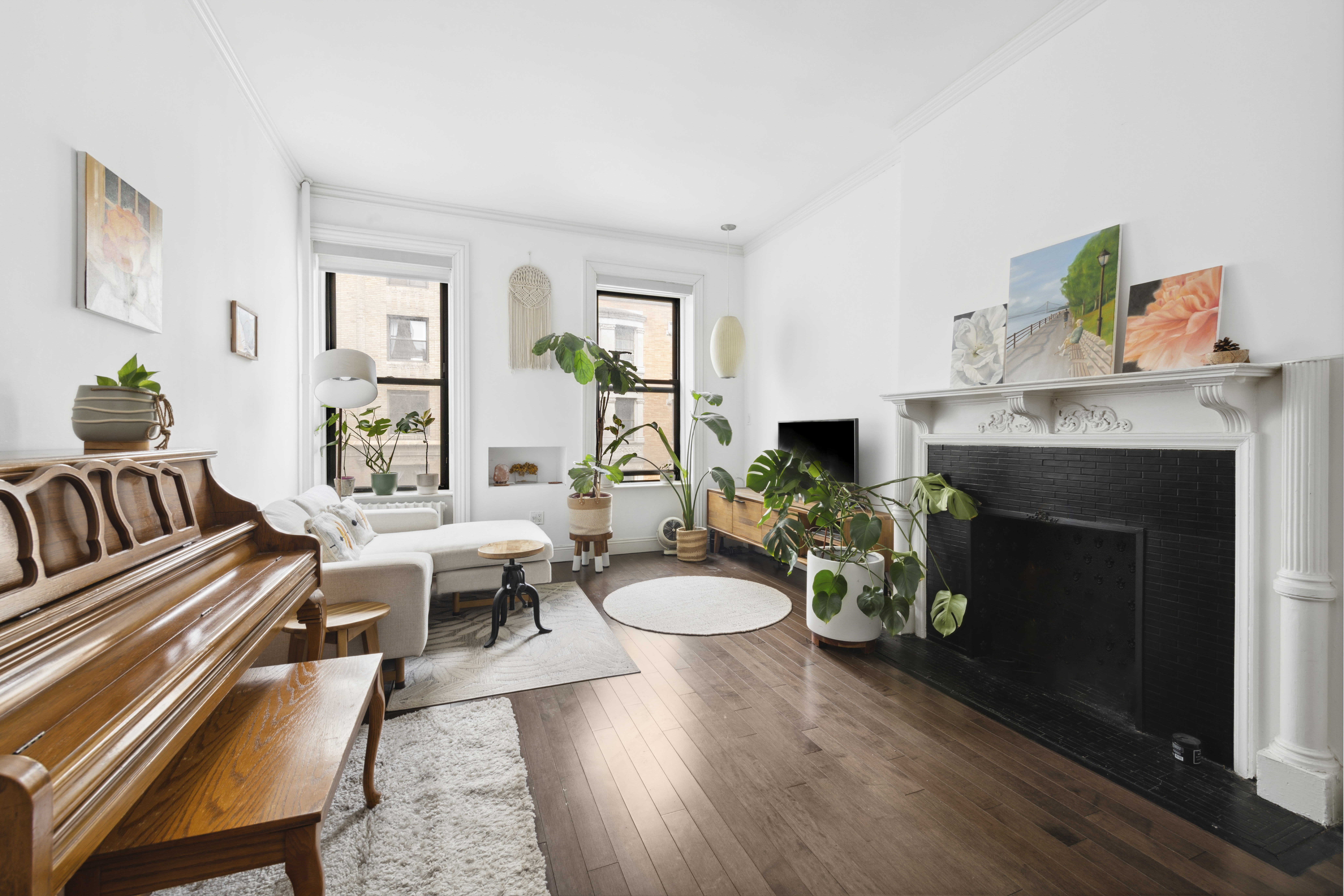 a living room with furniture and a fireplace