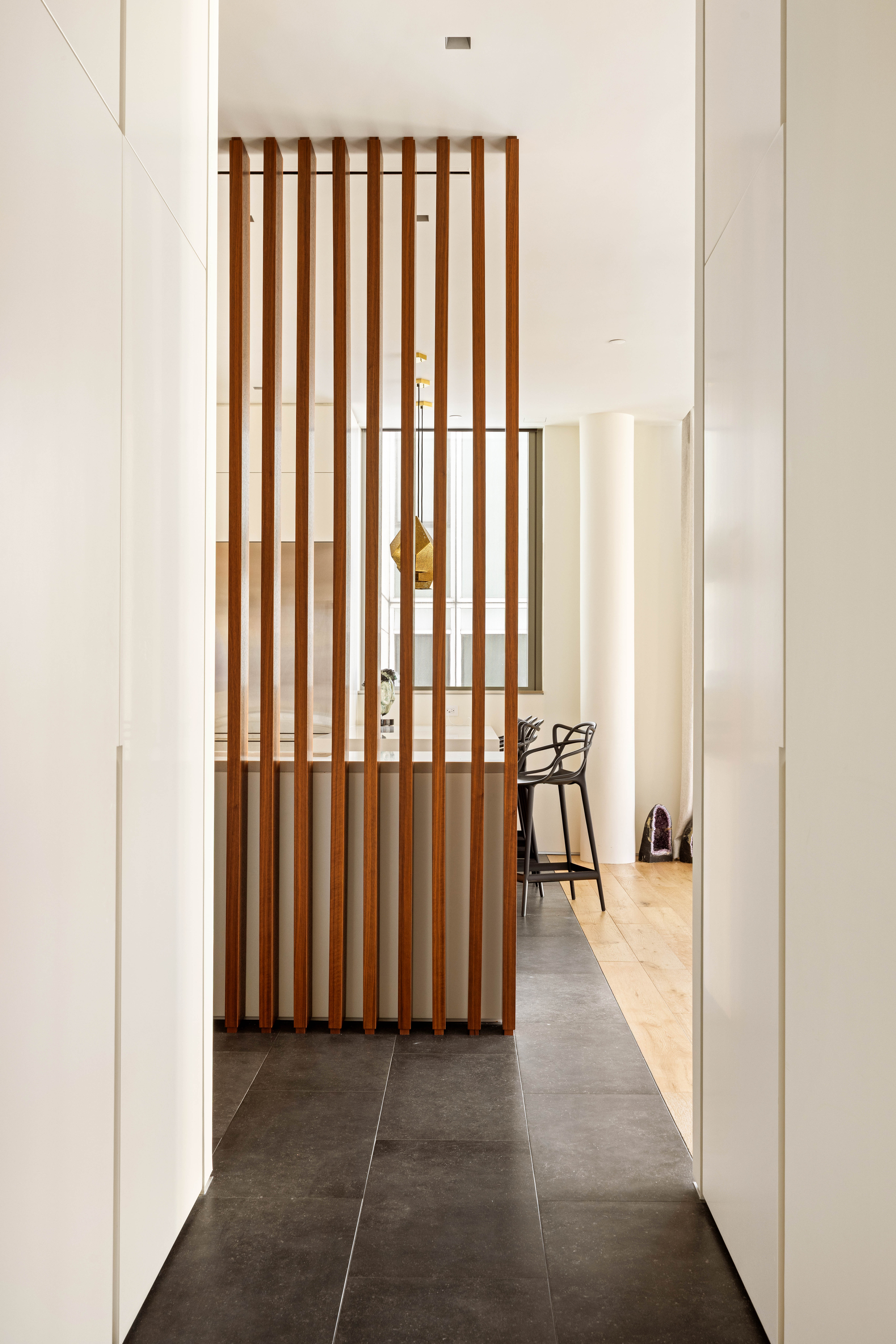 166 Perry Street, Unit 5A Manhattan, NY 10014 - Photo 21 of 25 a view of a hallway with wooden floor and furniture