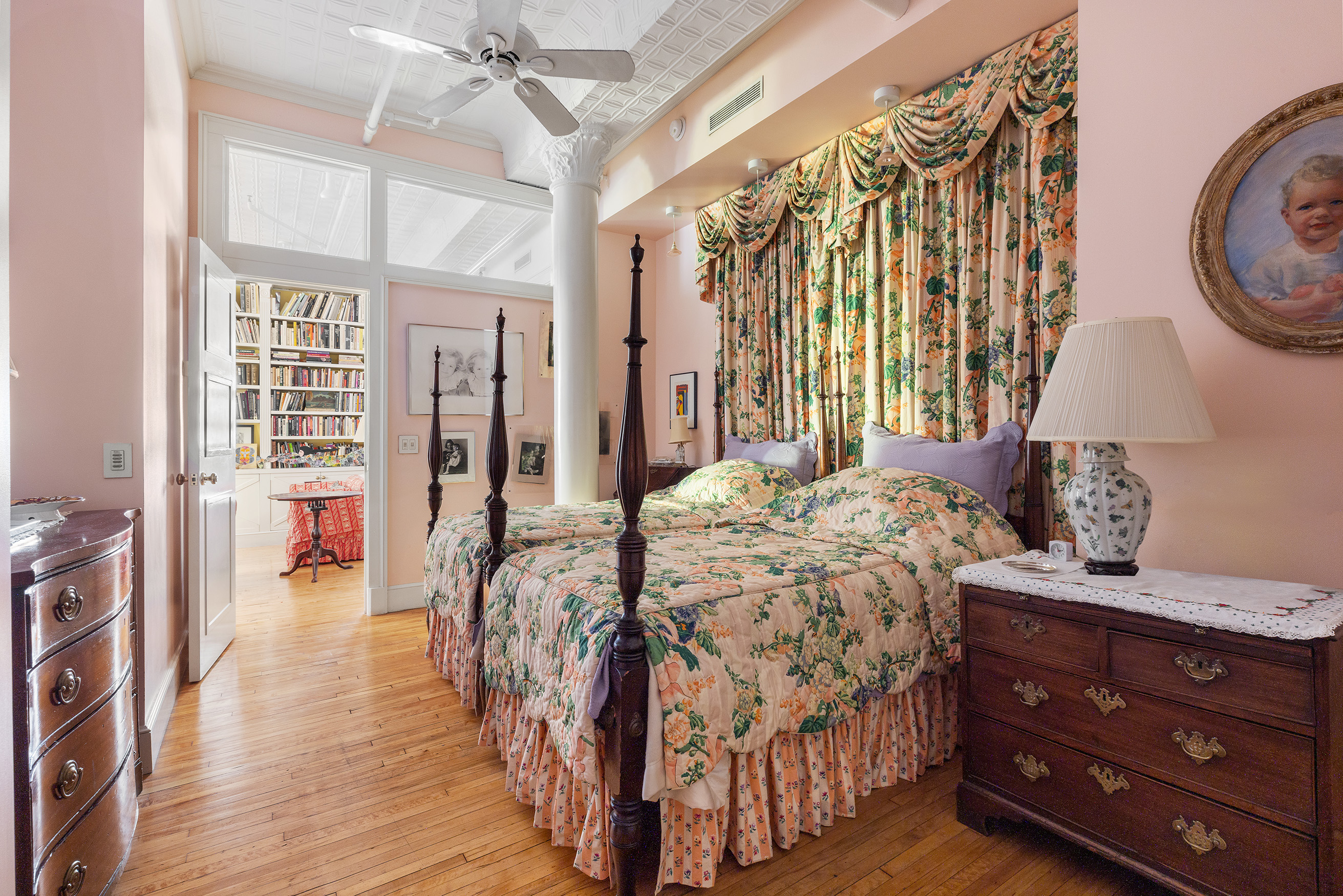 59 Wooster Street, Unit 3E Manhattan, NY 10012 - Photo 8 of 12 a bedroom with a bed and a table in it