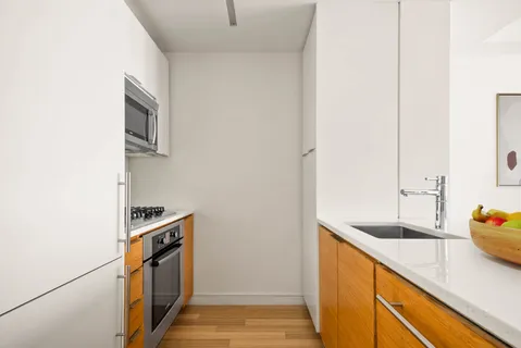 a kitchen that has a sink and a stove