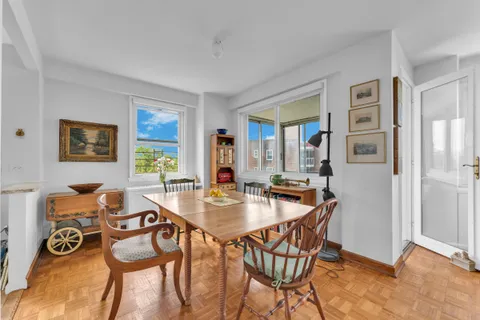 a dining room with furniture and window