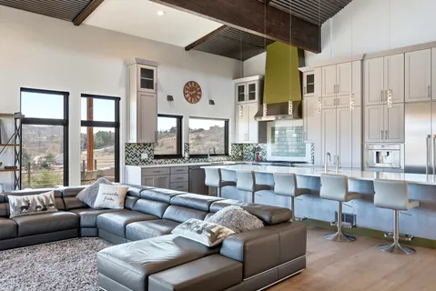 a kitchen with stainless steel appliances granite countertop a refrigerator and a sink