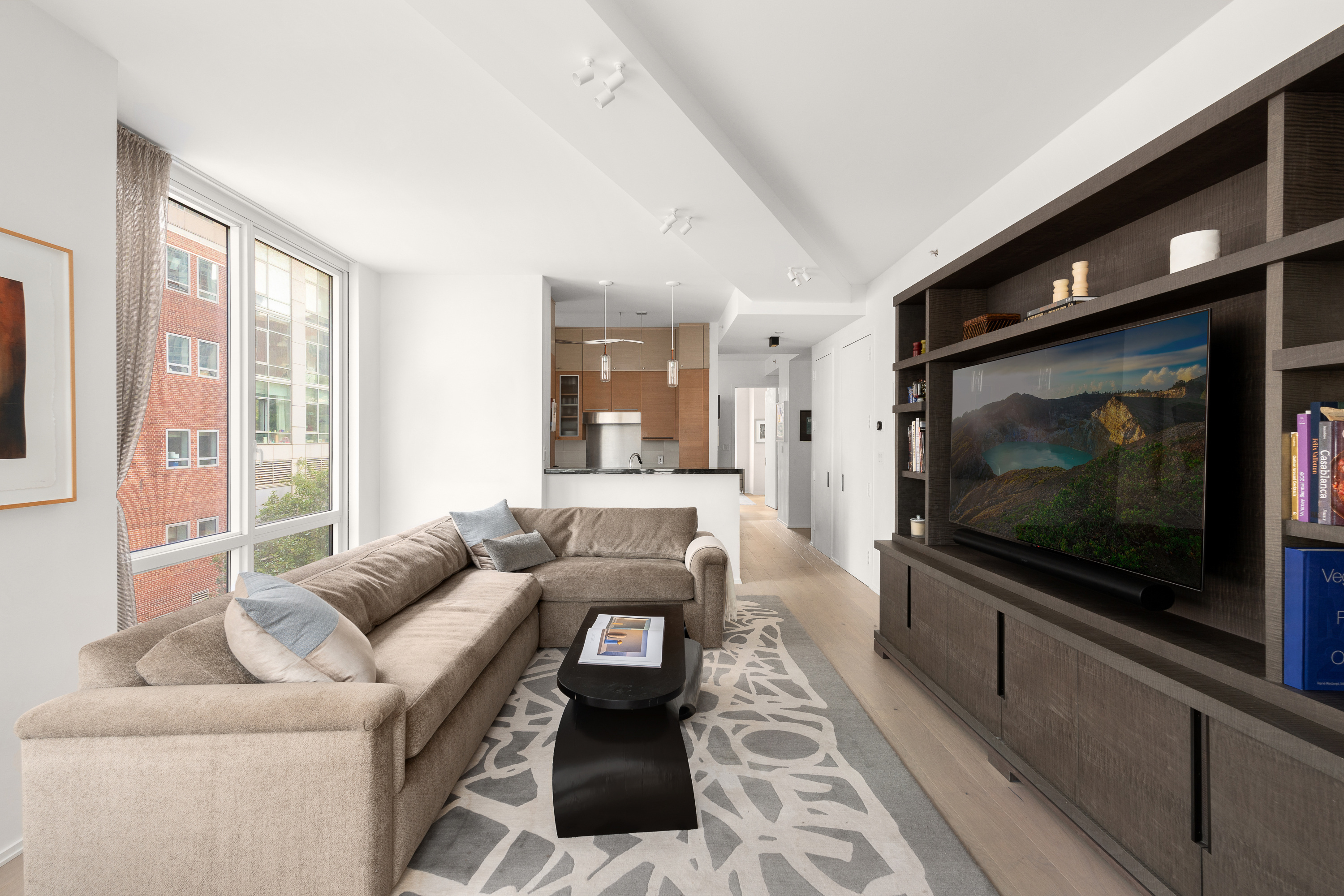 10 West End Avenue, Unit 4B Manhattan, NY 10023 - Photo 2 of 12 a living room with furniture and a flat screen tv