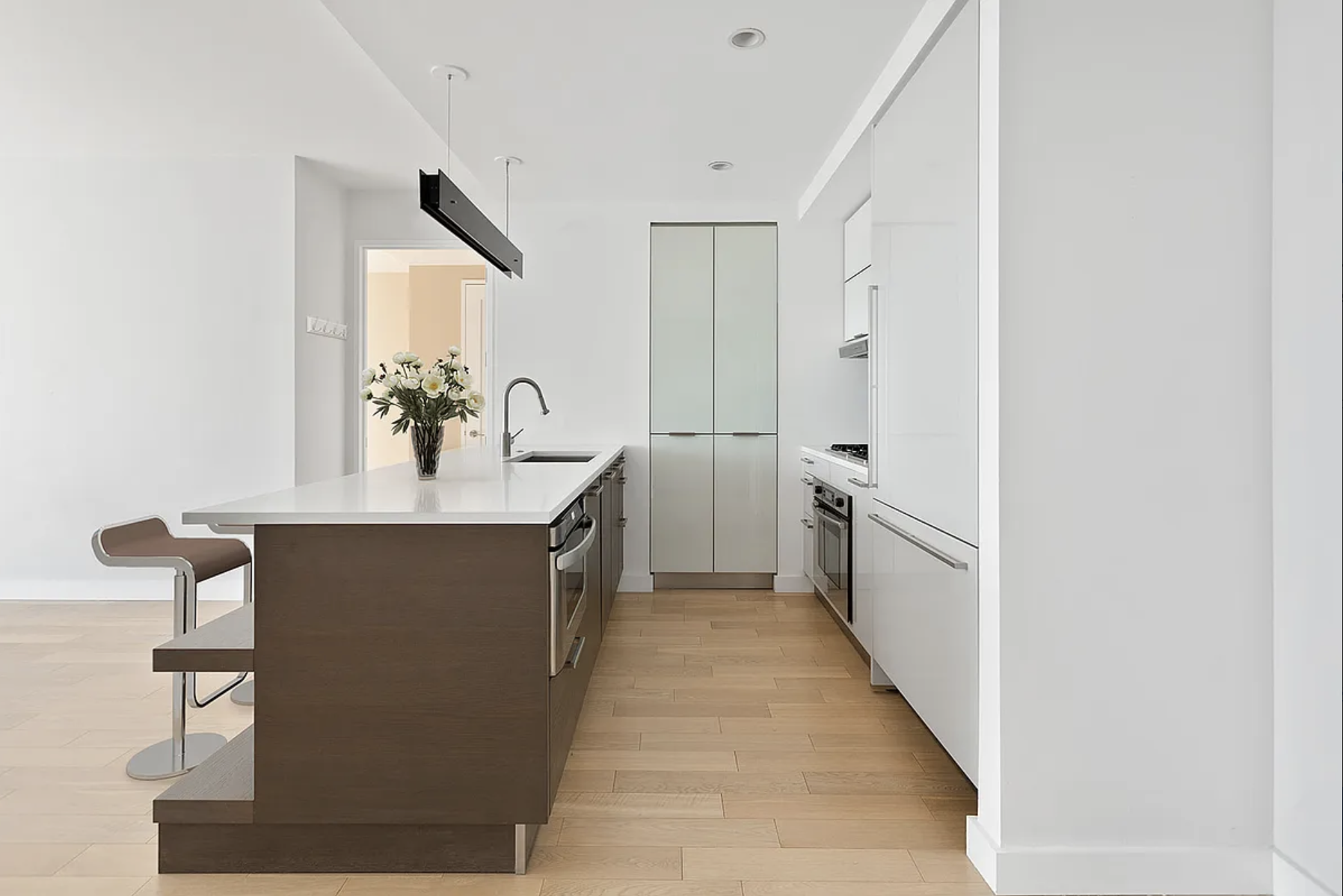22 North 6th Street, Unit 12J Brooklyn, NY 11249 - Photo 2 of 13 a kitchen with a sink and cabinets