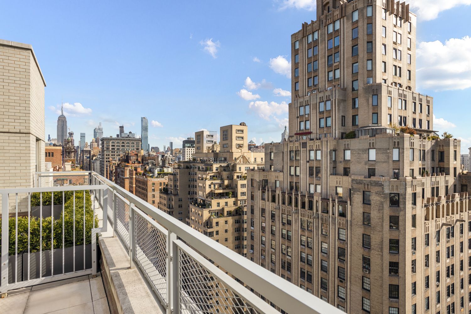 a view of a balcony with city view