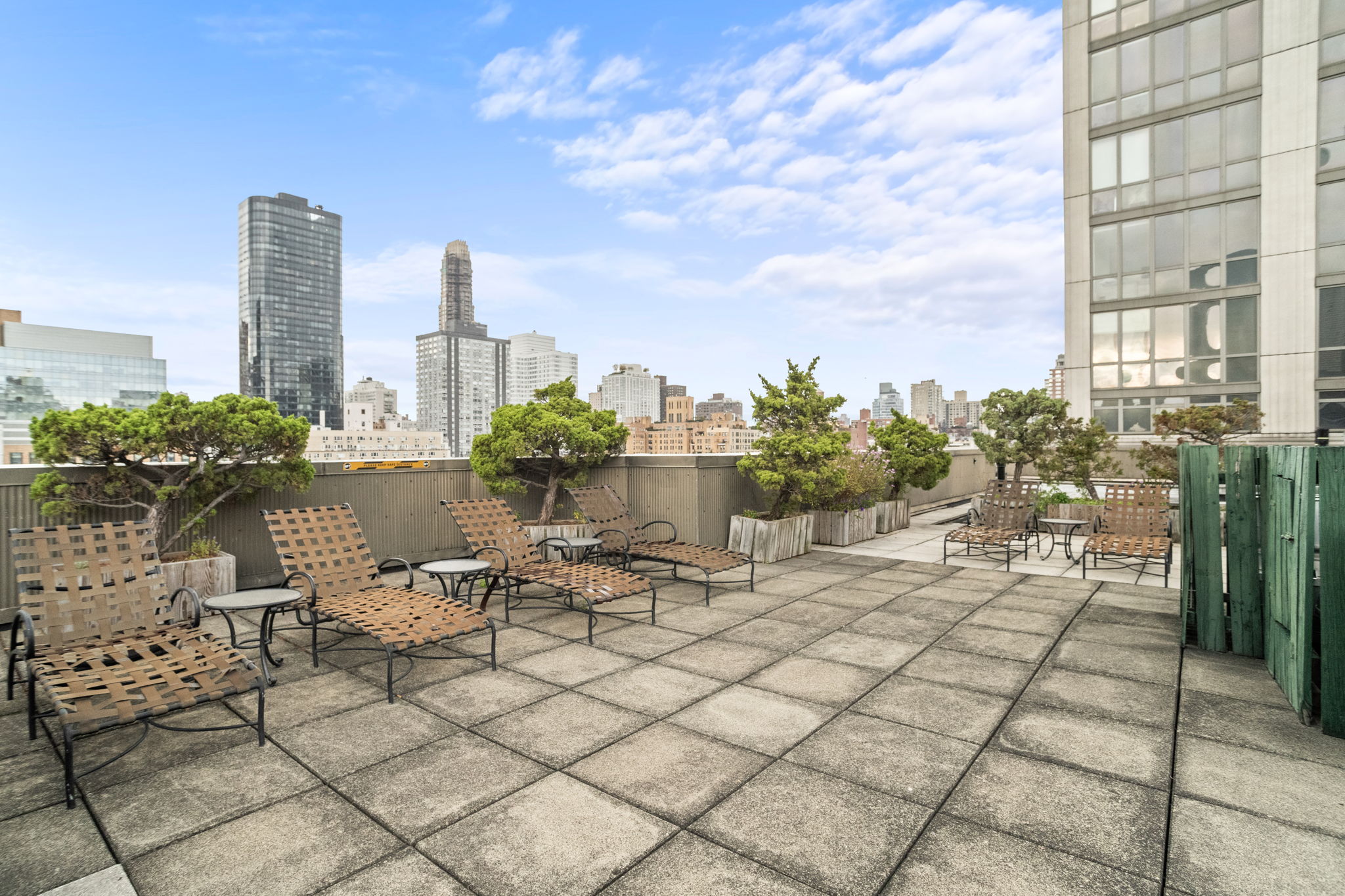 401 East 65th Street, Unit 12F Manhattan, NY 10065 - Photo 12 of 18 a view of a terrace with chairs