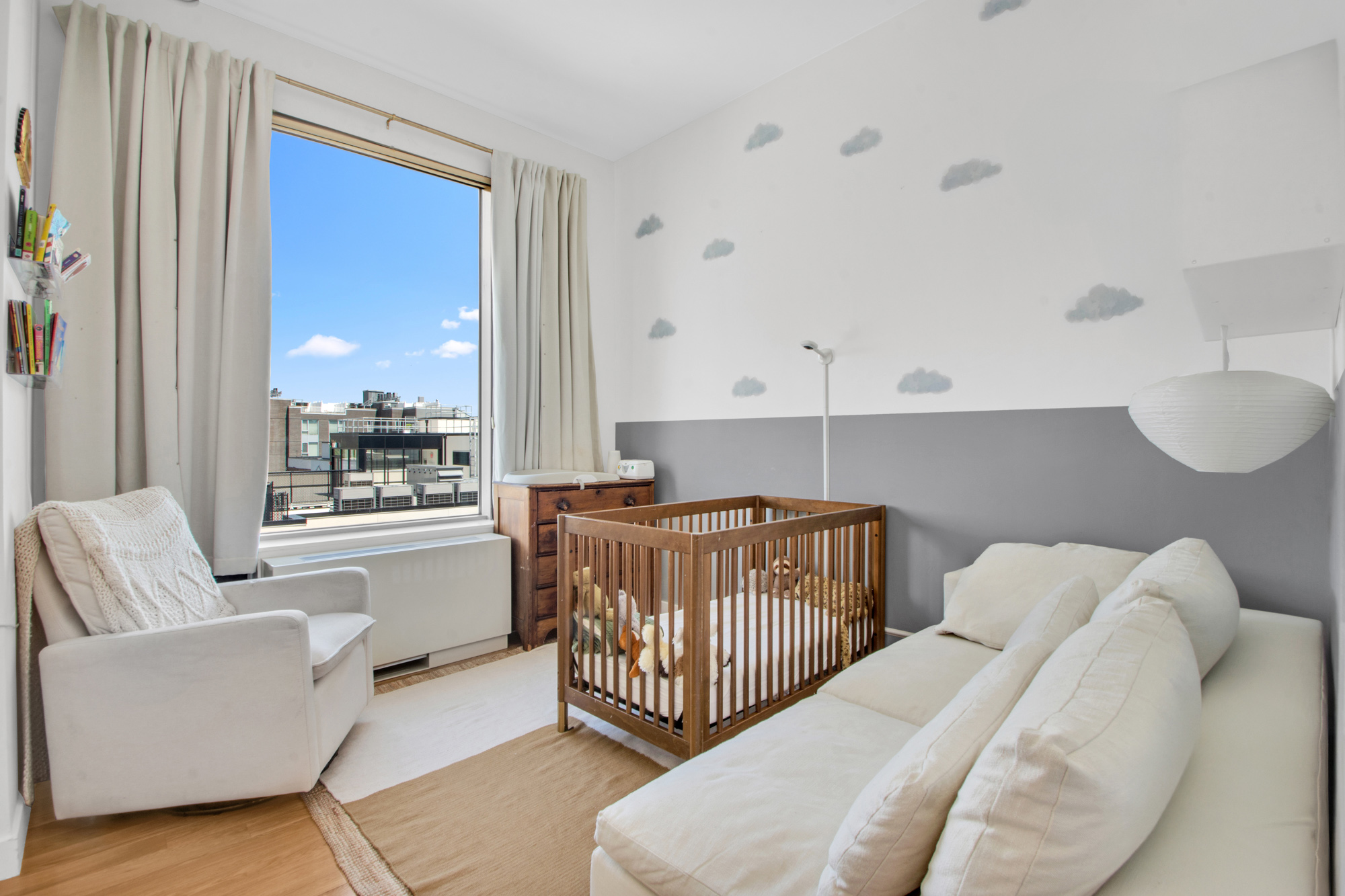 101 North 5th Street, Unit 5A Brooklyn, NY 11249 - Photo 17 of 26 a bedroom with furniture and a large window