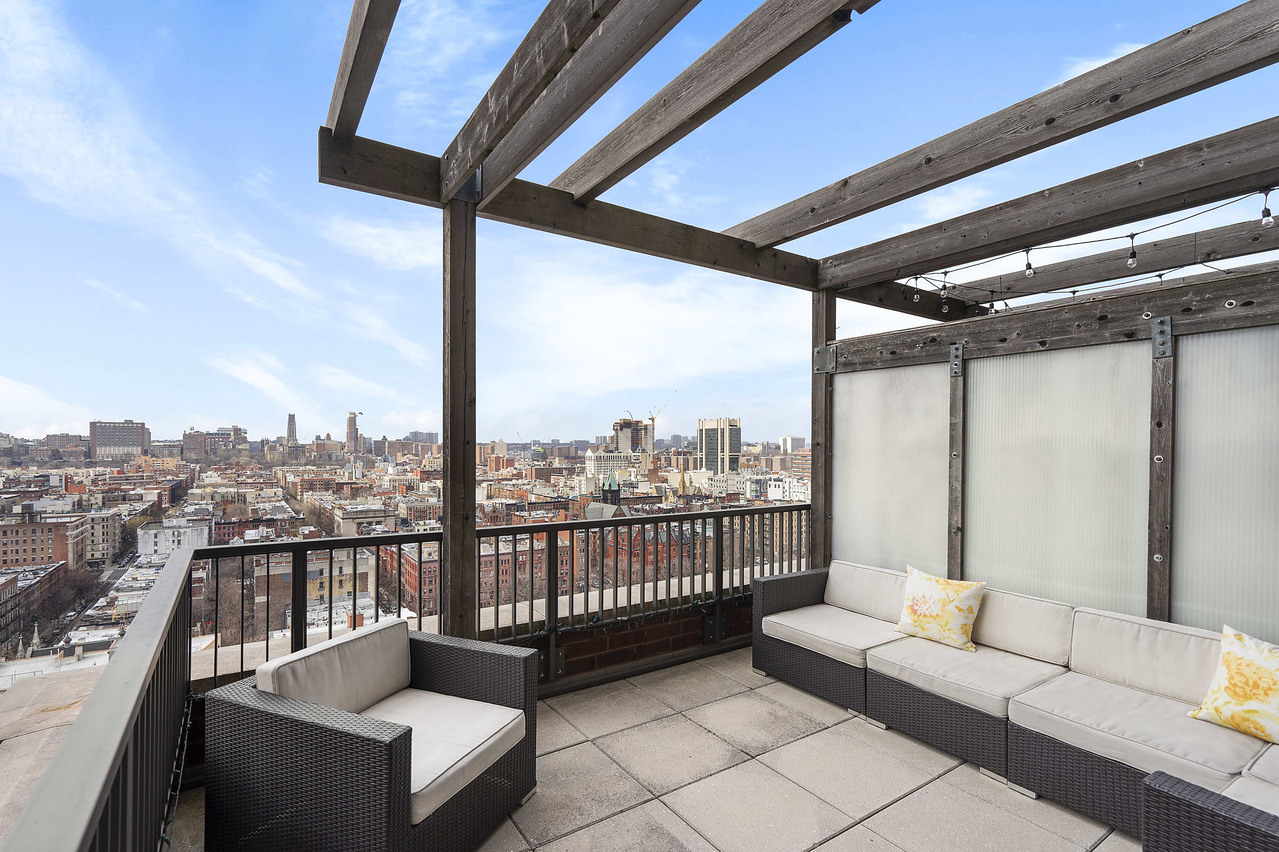 1485 5th Avenue, Unit 18/19H Manhattan, NY 10035 - Photo 17 of 24 a view of a balcony with furniture