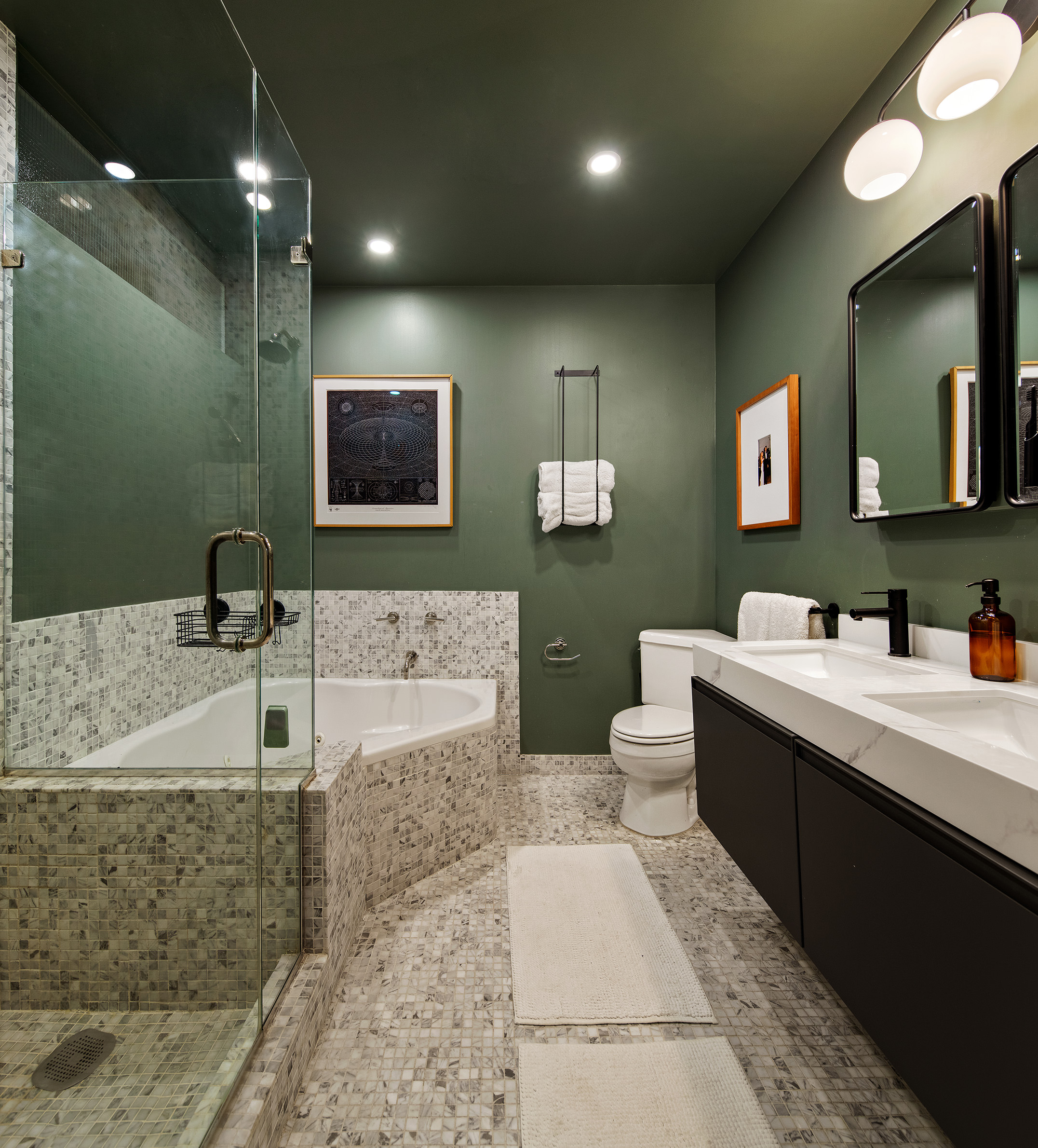 366 6th Avenue Brooklyn, NY 11215 - Photo 11 of 20 a bathroom with a double vanity sink a mirror and a bathtub