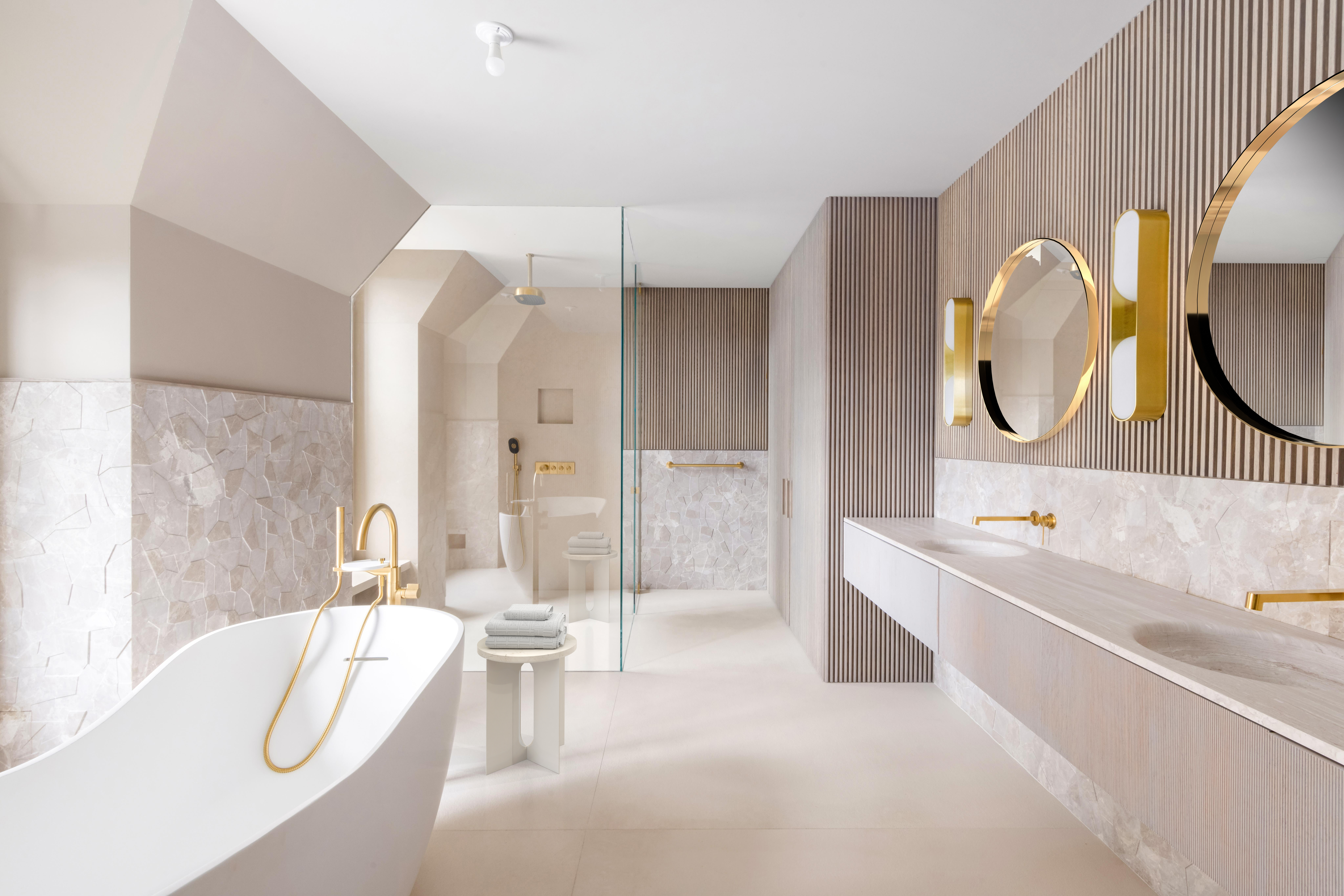 337 Riverside Drive Manhattan, NY 10025 - Photo 19 of 32 a bathroom with a tub a double vanity sink and a mirror