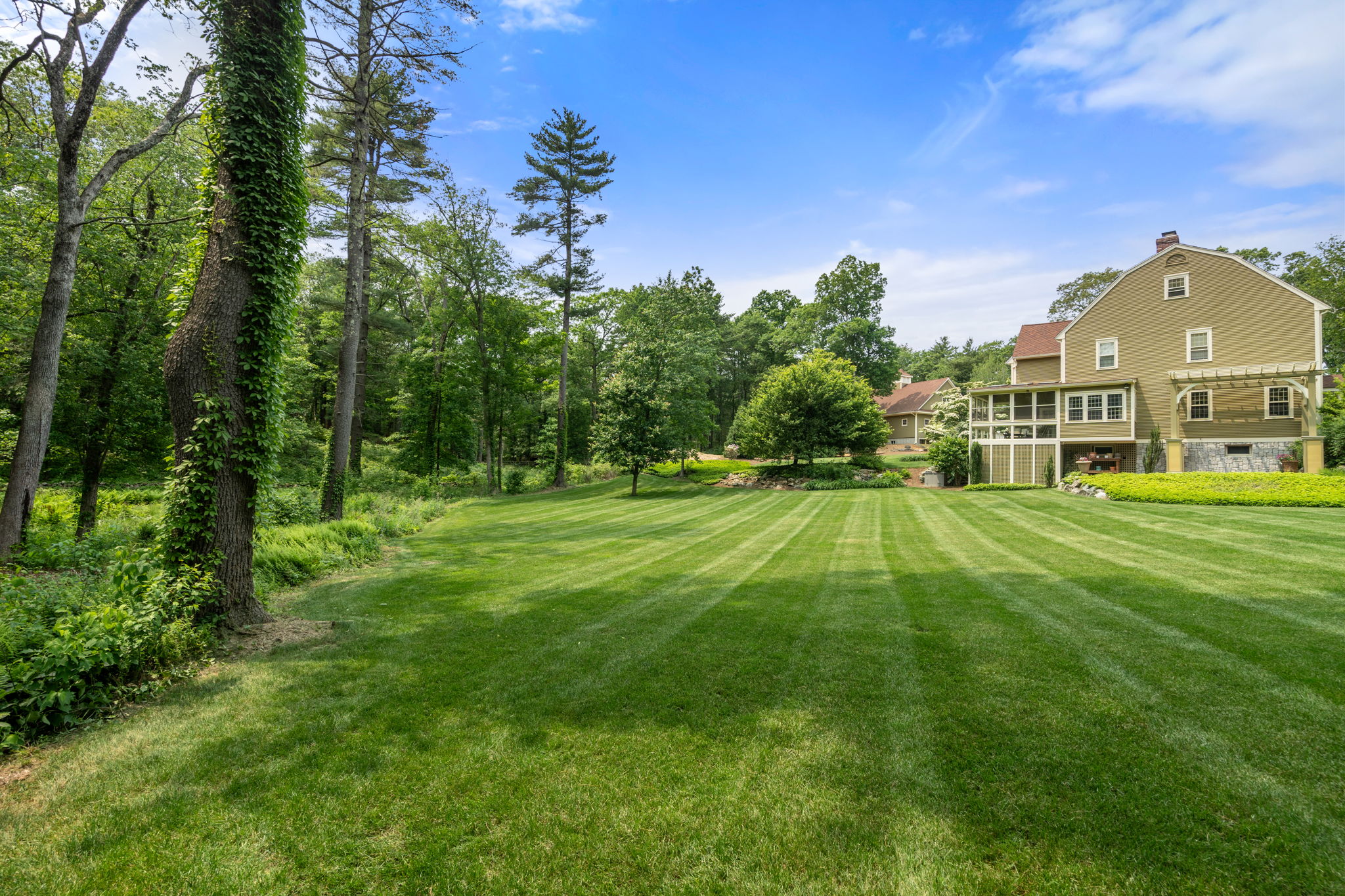 100 Farm Road Sherborn, MA 01770 - Photo 13 of 17 a view of a big yard with a house in the background