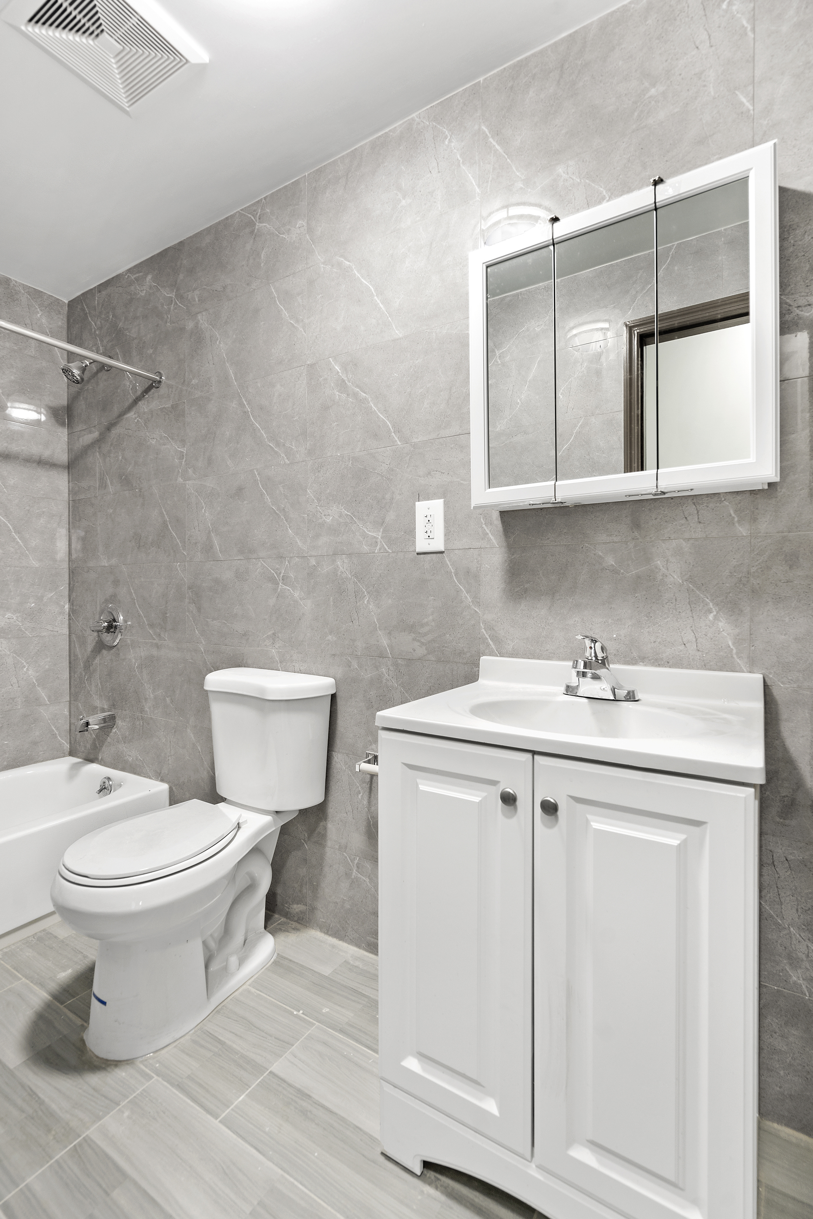 1389 Fulton Street, Unit 3 Brooklyn, NY 11216 - Photo 6 of 12 a bathroom with a sink toilet and mirror