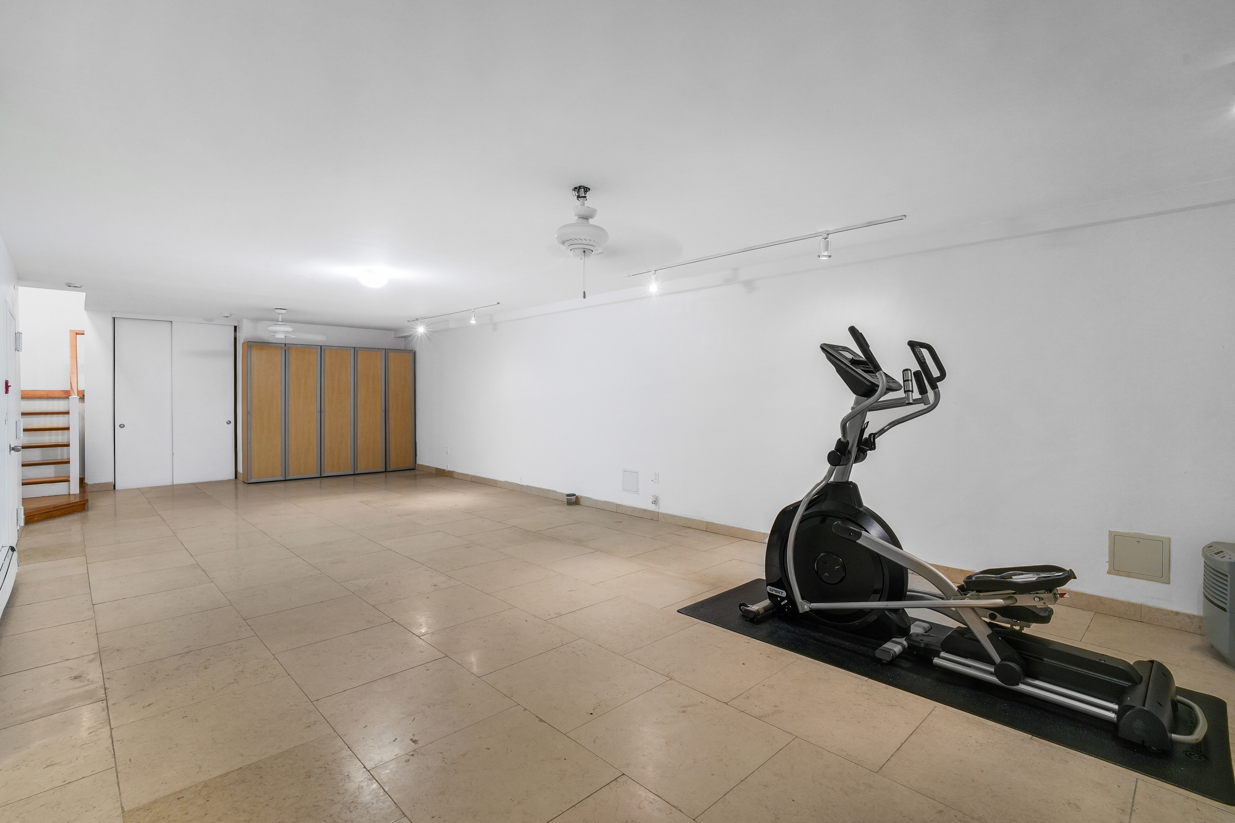182 East 117th Street Manhattan, NY 10035 - Photo 10 of 13 a view of a room with gym equipment