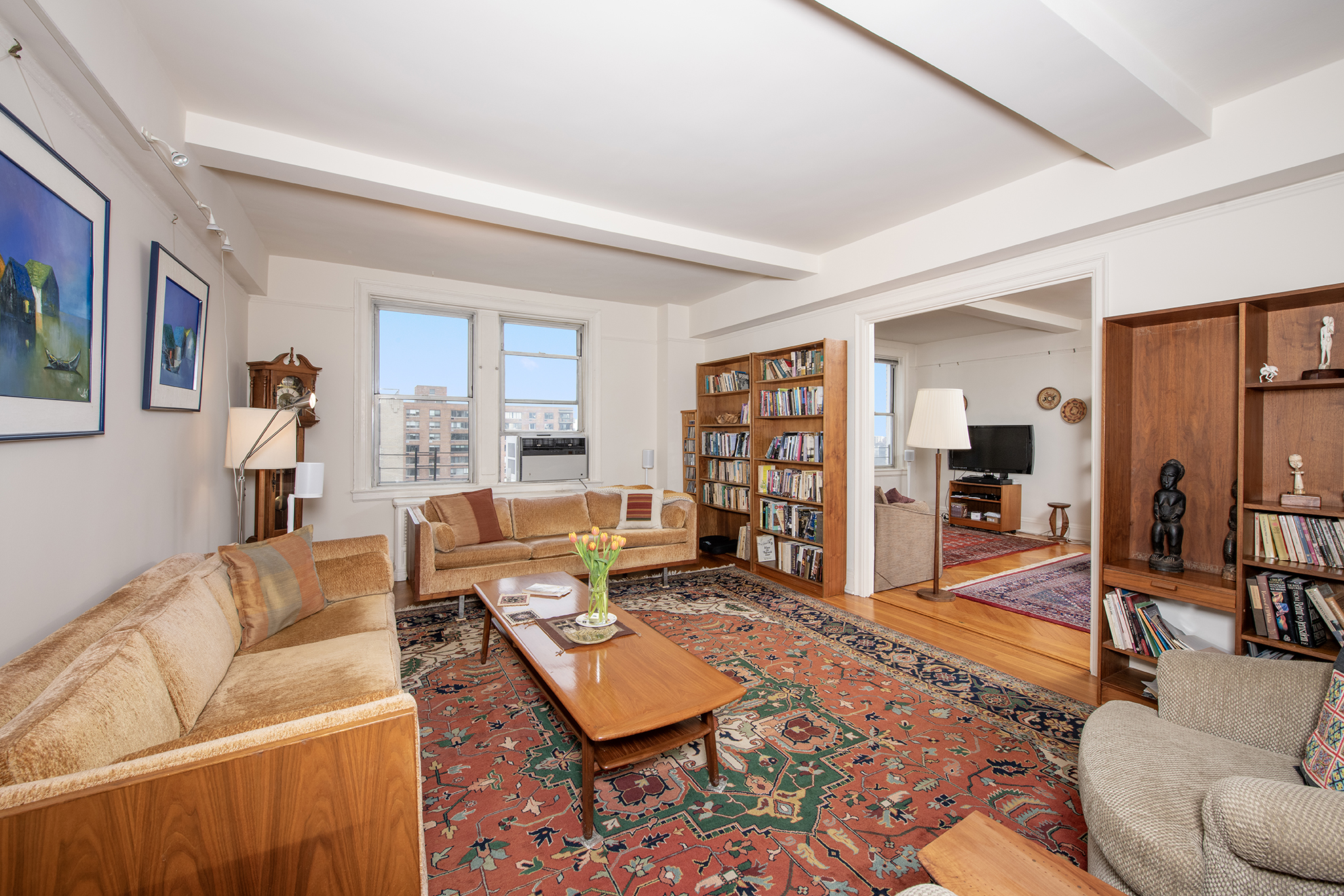 12 West 96th Street, Unit 16A Manhattan, NY 10025 - Photo 1 of 13 a living room with furniture and a flat screen tv