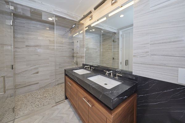 613 Baltic Street, Unit 6C Brooklyn, NY 11217 - Photo 5 of 9 a bathroom with a sink a vanity and a mirror