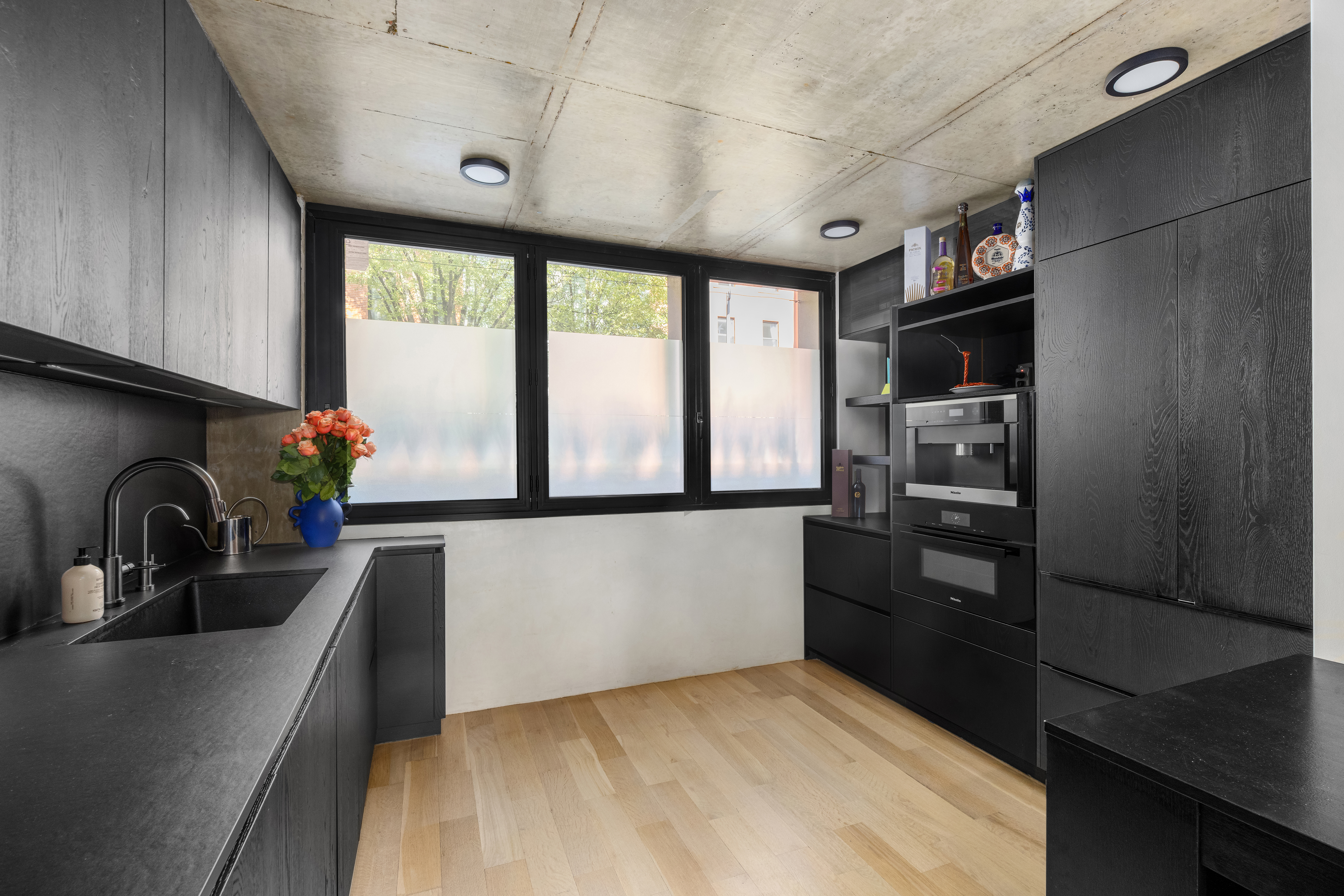 126 South 2nd Street, Unit GARDEN Brooklyn, NY 11249 - Photo 10 of 30 a kitchen with a refrigerator and a sink