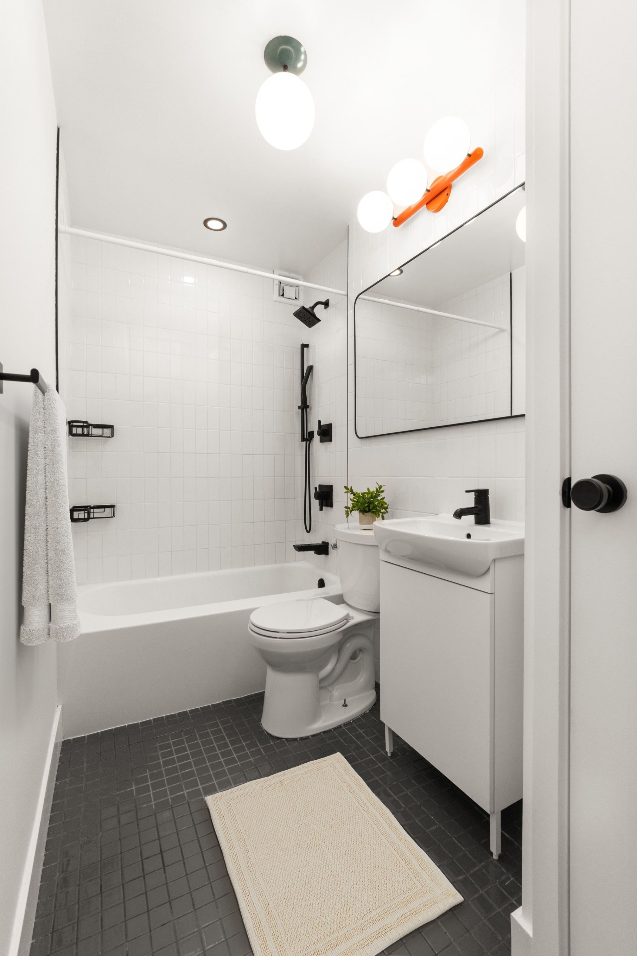 40 Clinton Street, Unit 1M Brooklyn, NY 11201 - Photo 7 of 8 a bathroom with a sink a toilet and shower