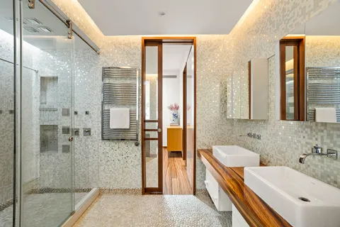 a bathroom with a tub sink and shower