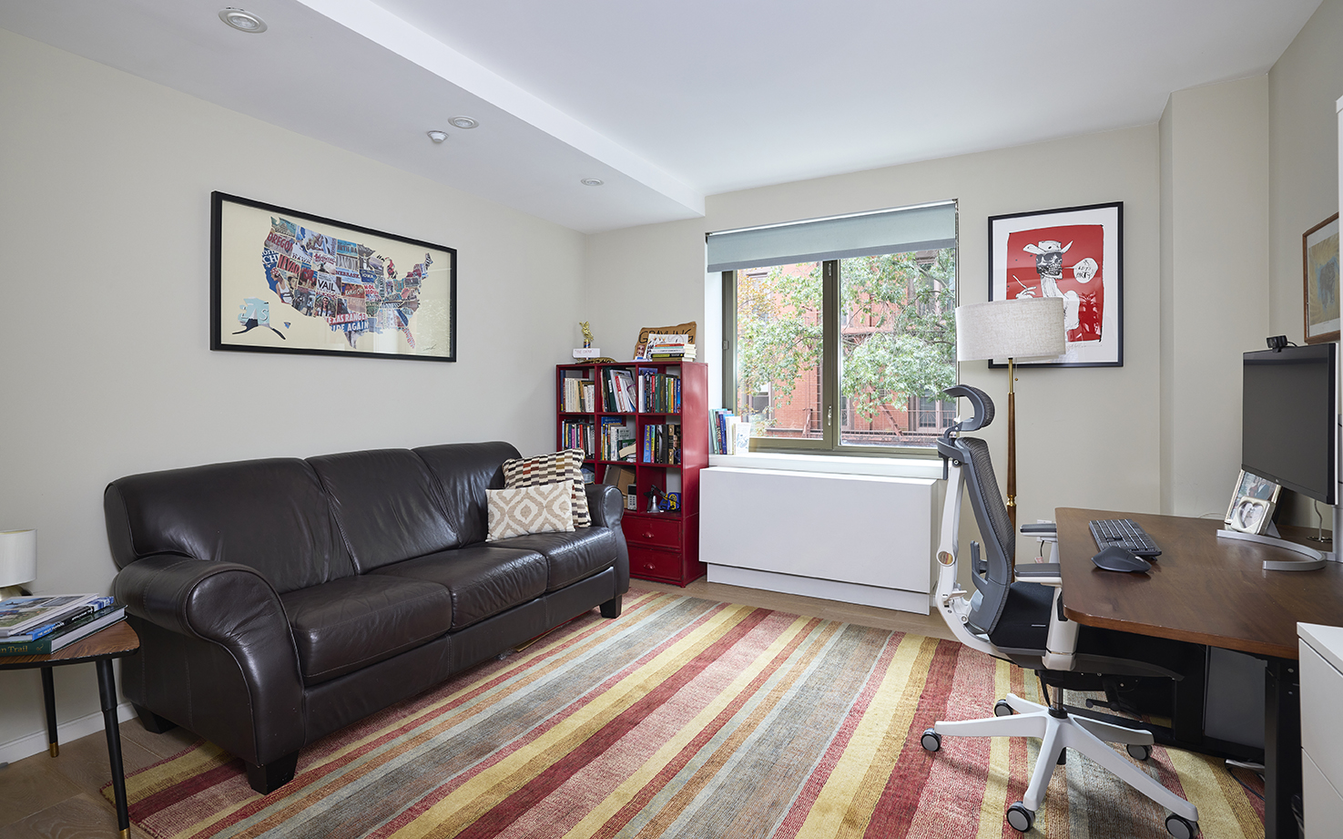 101 West 87th Street, Unit 205 Manhattan, NY 10024 - Photo 8 of 14 a living room with furniture and a flat screen tv with wooden floor