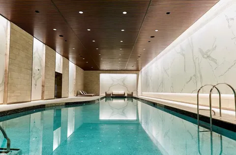 a view of swimming pool with a balcony