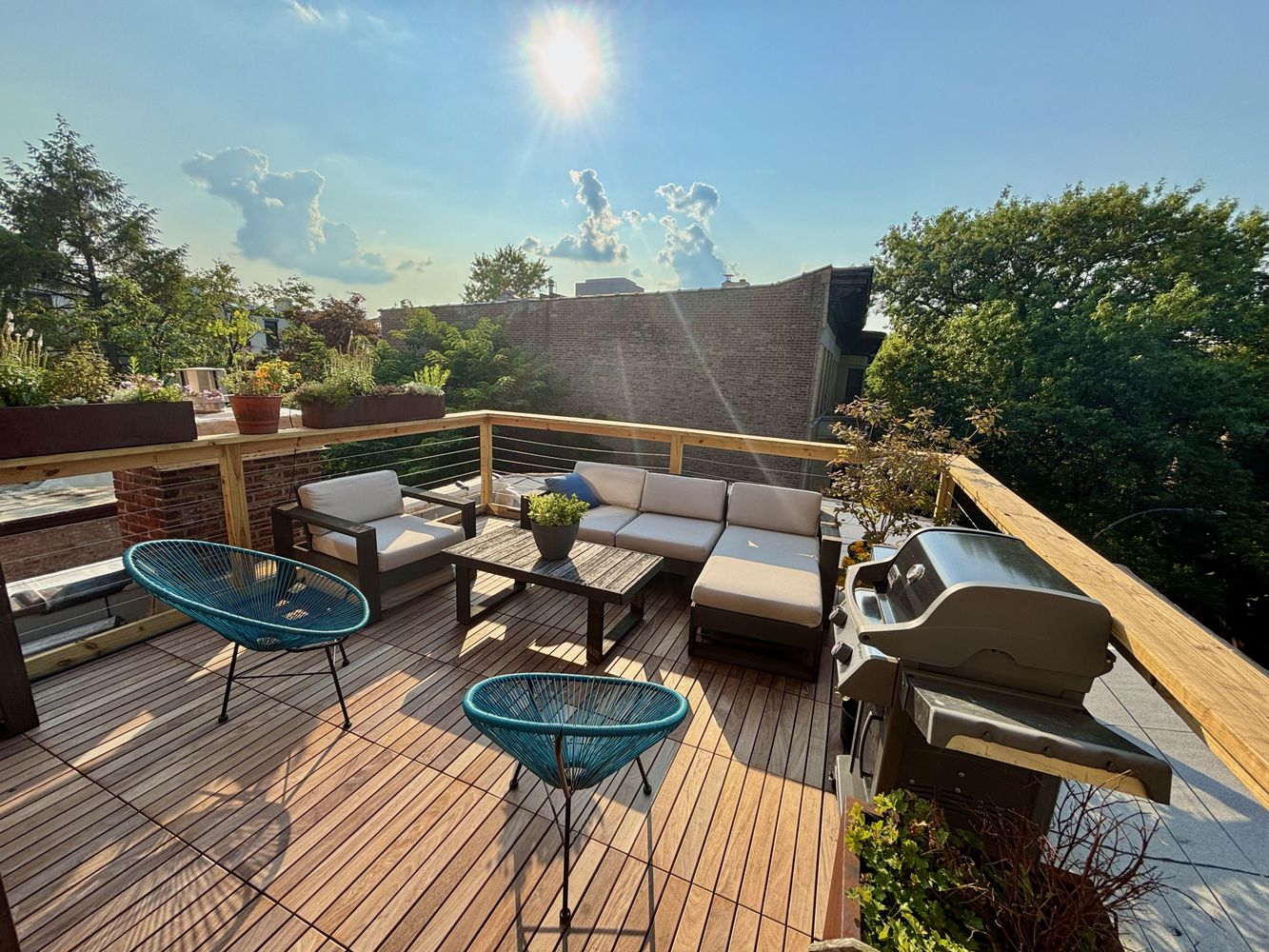 a balcony with furniture and a garden