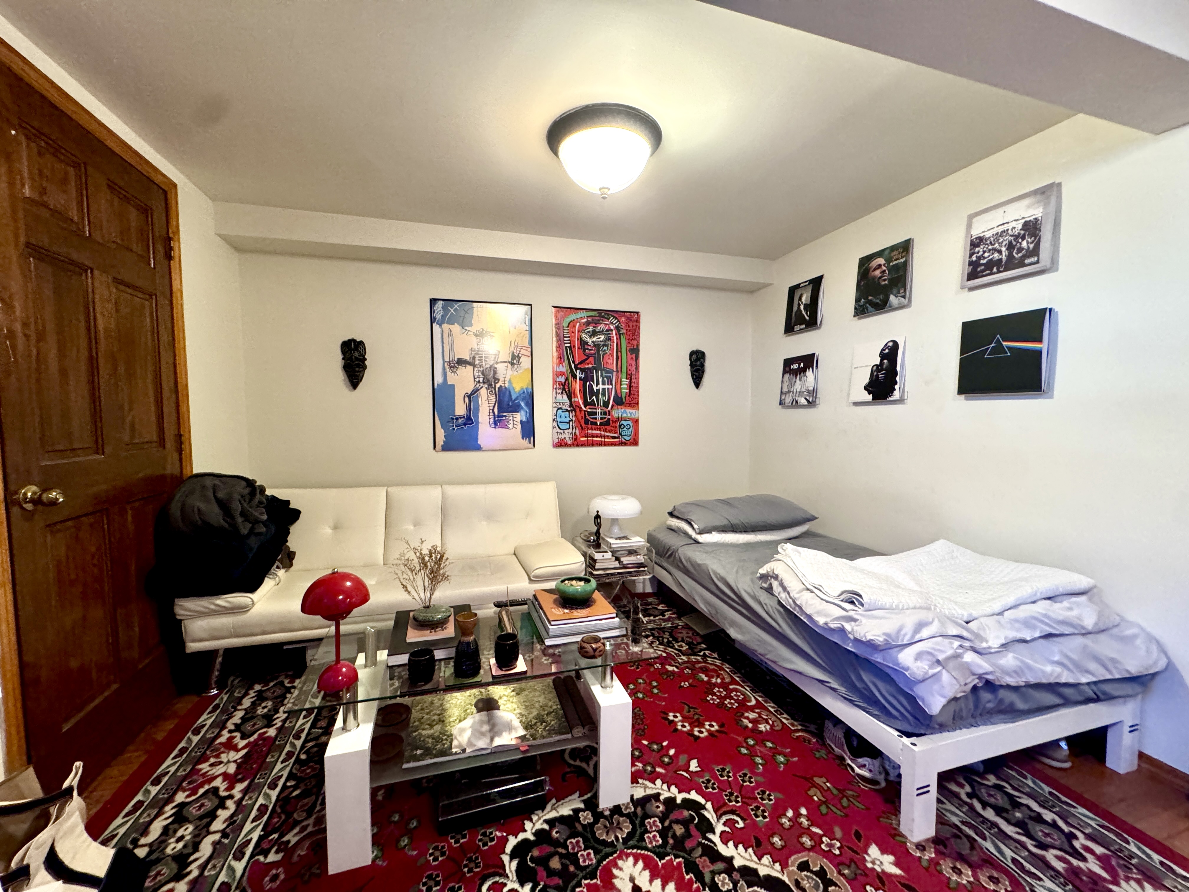 1561 Carroll Street, Unit Undisclosed Brooklyn, NY 11213 - Photo 4 of 9 a bed room with a bed and a couch