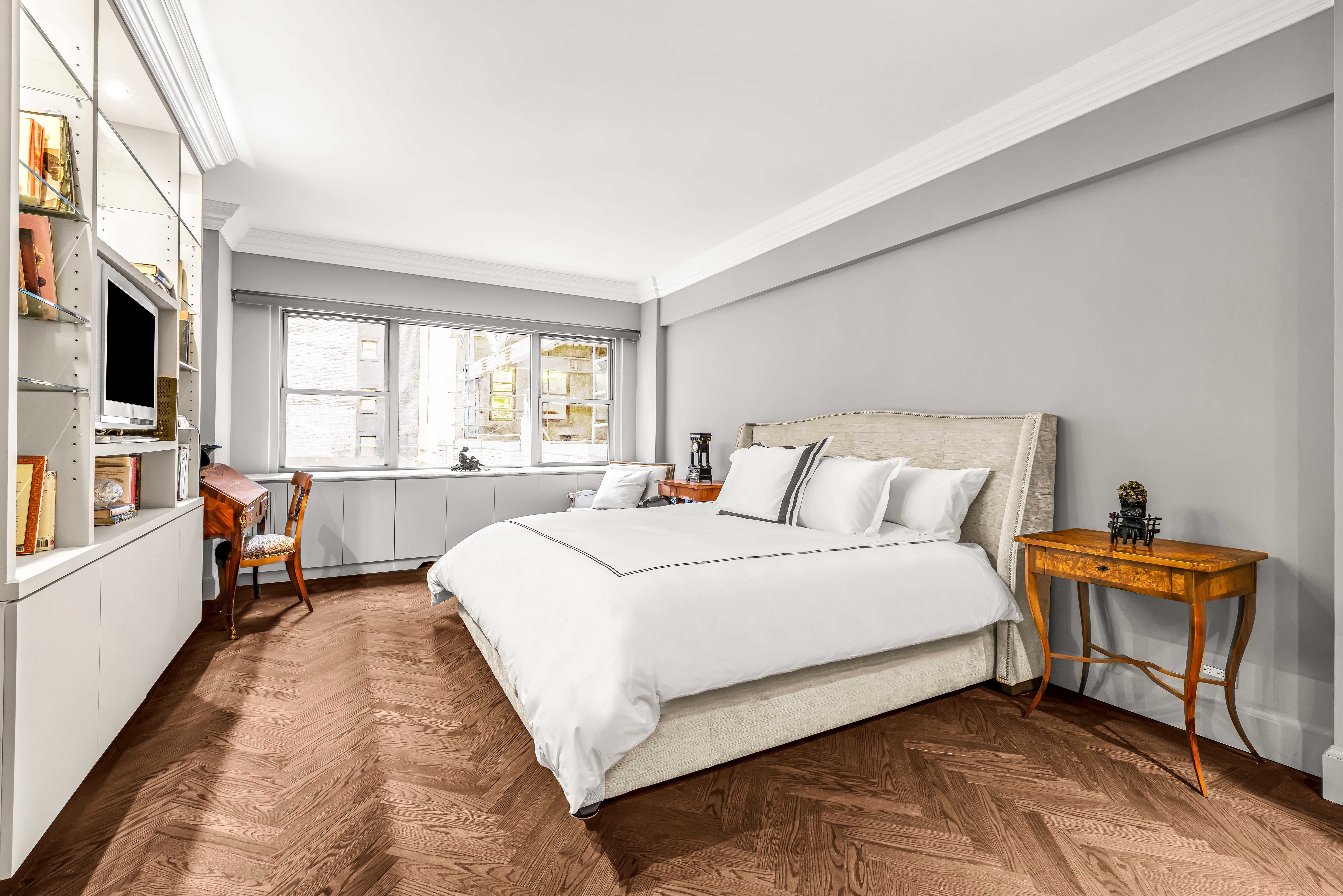 785 5th Avenue, Unit 3C Manhattan, NY 10022 - Photo 7 of 16 a bedroom with bed and a large window