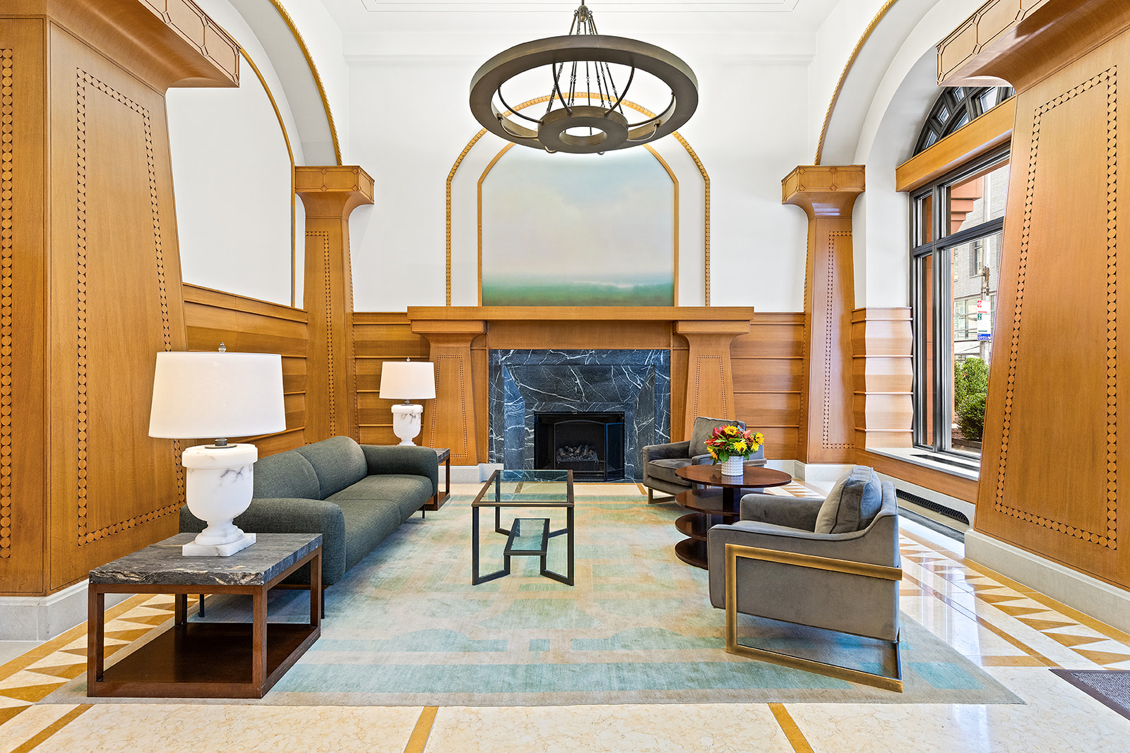 205 West 76th Street, Unit PH1F Manhattan, NY 10023 - Photo 12 of 18 a living room with furniture a fireplace and a large window