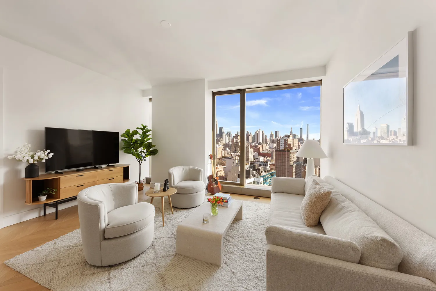 a living room with furniture and a flat screen tv