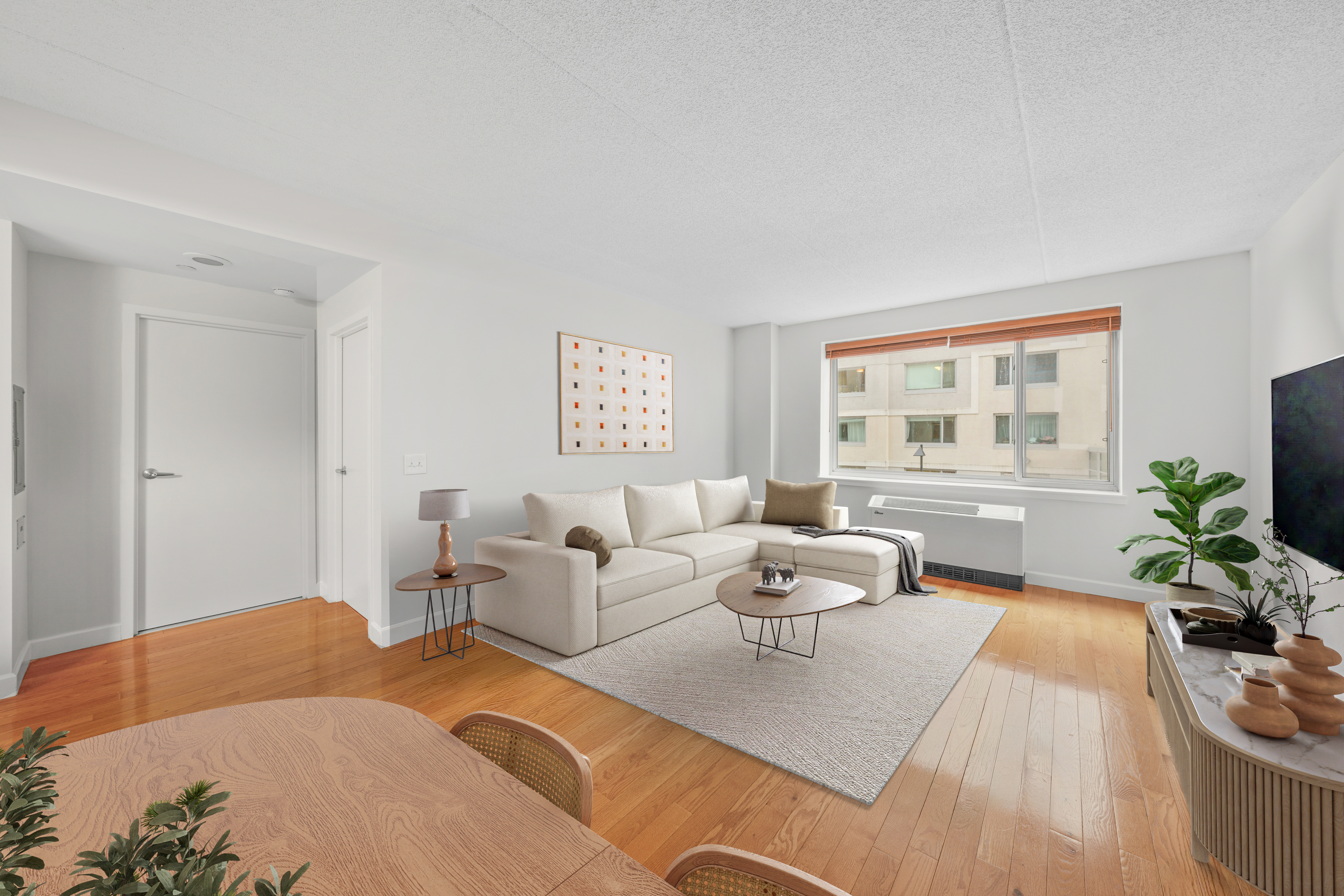 40 West 116th Street, Unit B301 Manhattan, NY 10026 - Photo 1 of 17 a living room with furniture and a flat screen tv