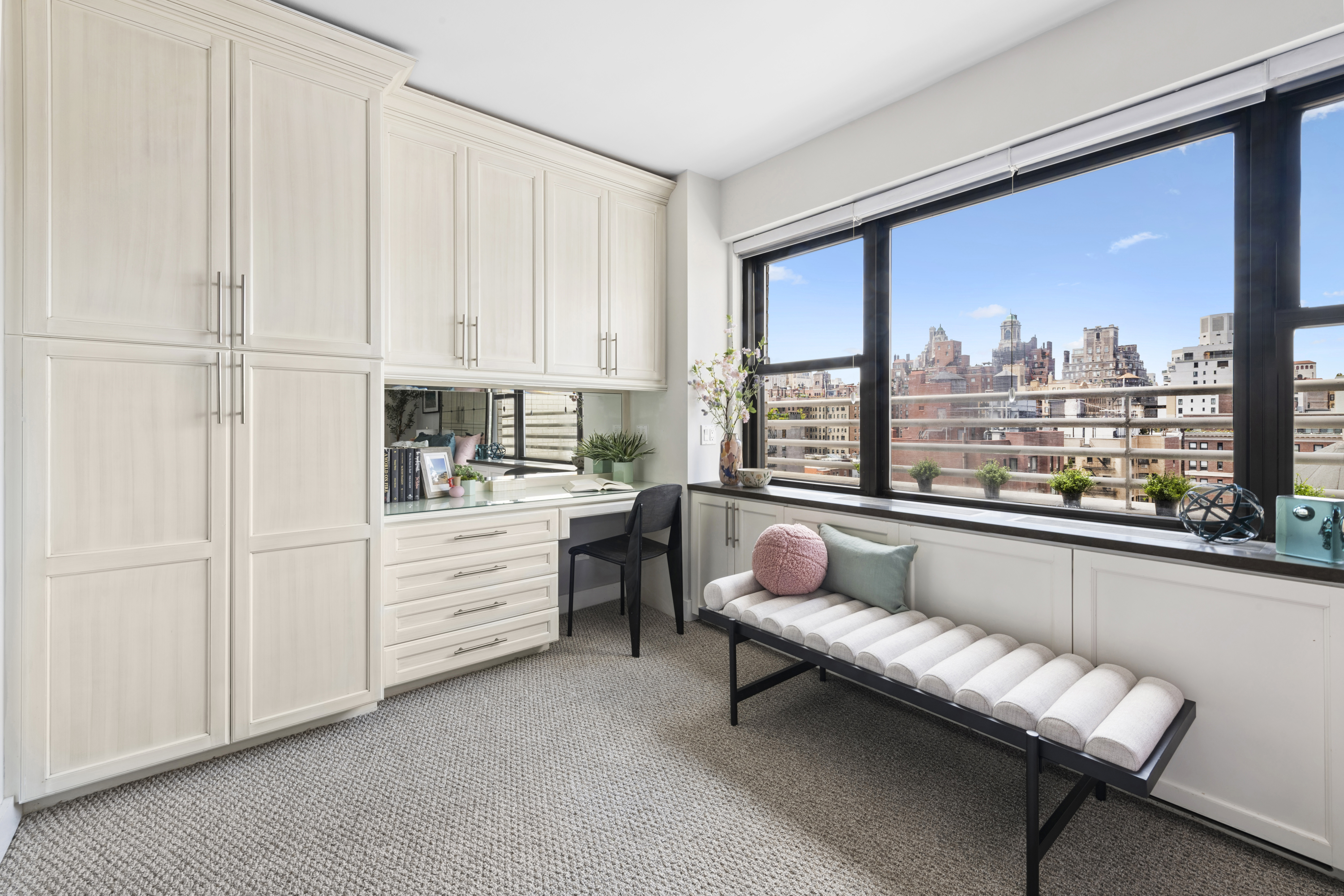196 East 75th Street, Unit 16G Manhattan, NY 10021 - Photo 6 of 10 a living room with furniture and a large window