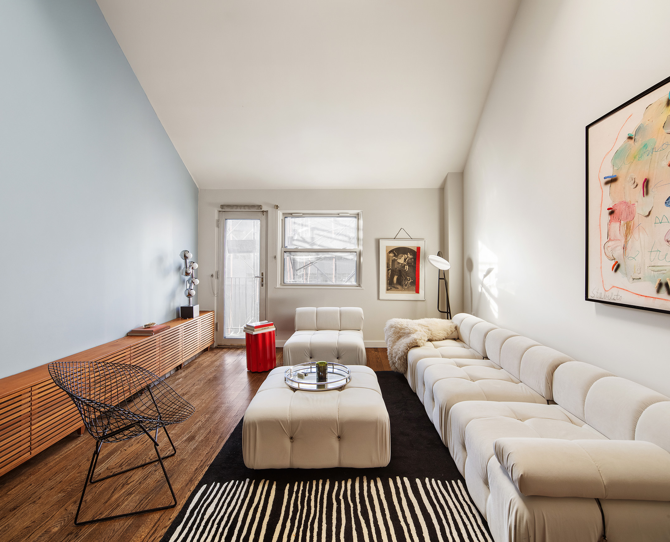 211 Thompson Street, Unit PH6D Manhattan, NY 10012 - Photo 7 of 10 a bedroom with furniture and a large window