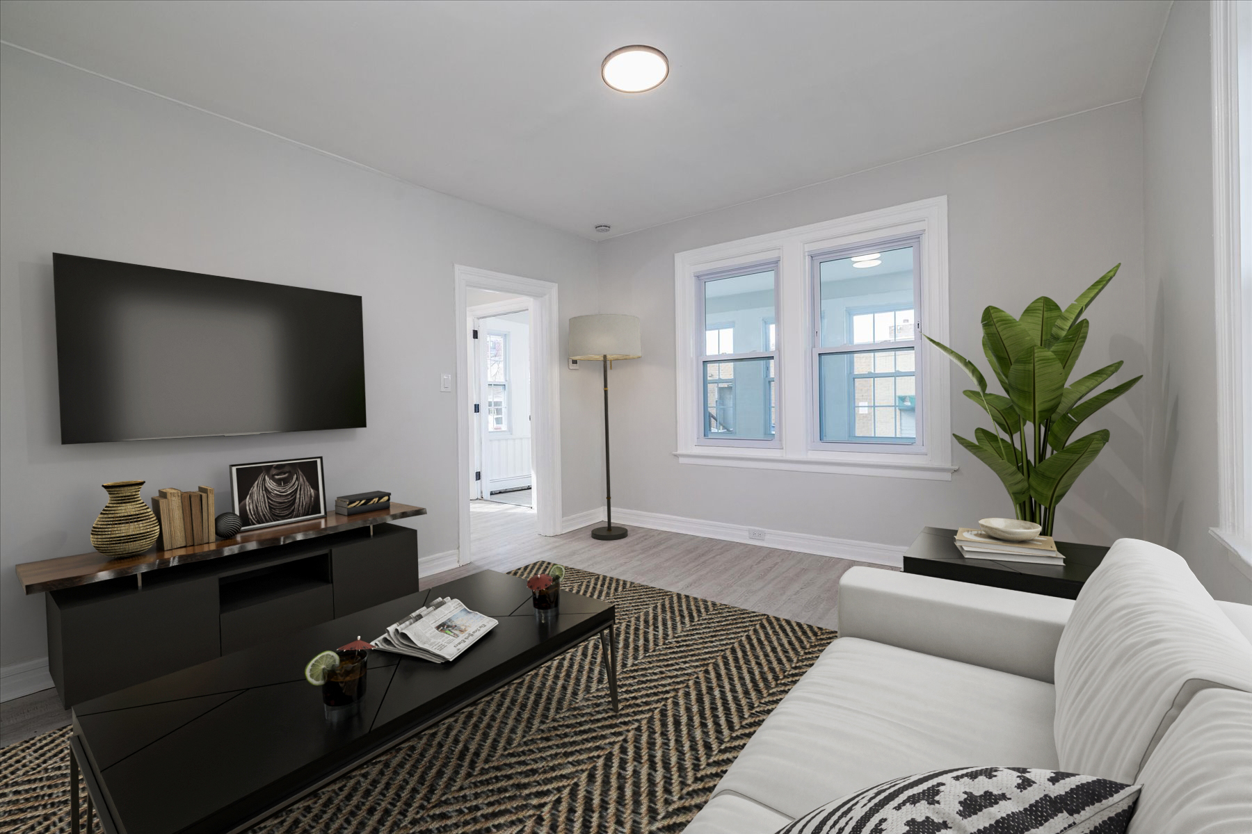 13-03 Brunswick Avenue Queens, NY 11691 - Photo 11 of 27 a living room with furniture and a flat screen tv