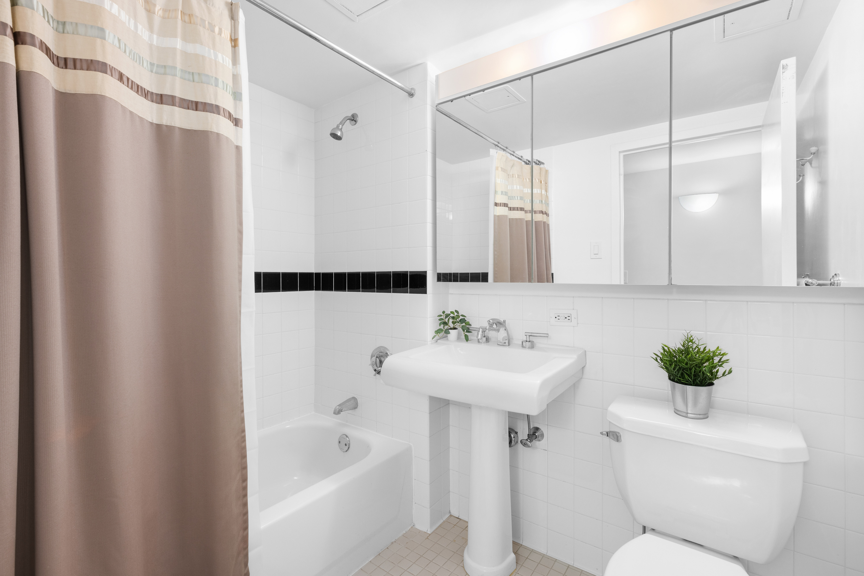 300 West 145th Street, Unit 1QQ Manhattan, NY 10039 - Photo 9 of 15 a bathroom with a sink toilet and shower