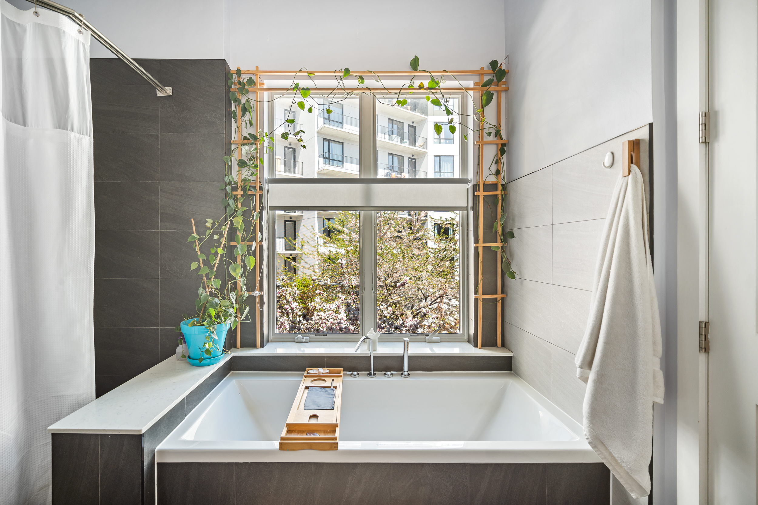 65 Jackson Street Brooklyn, NY 11211 - Photo 16 of 36 a bathroom with a tub and shower