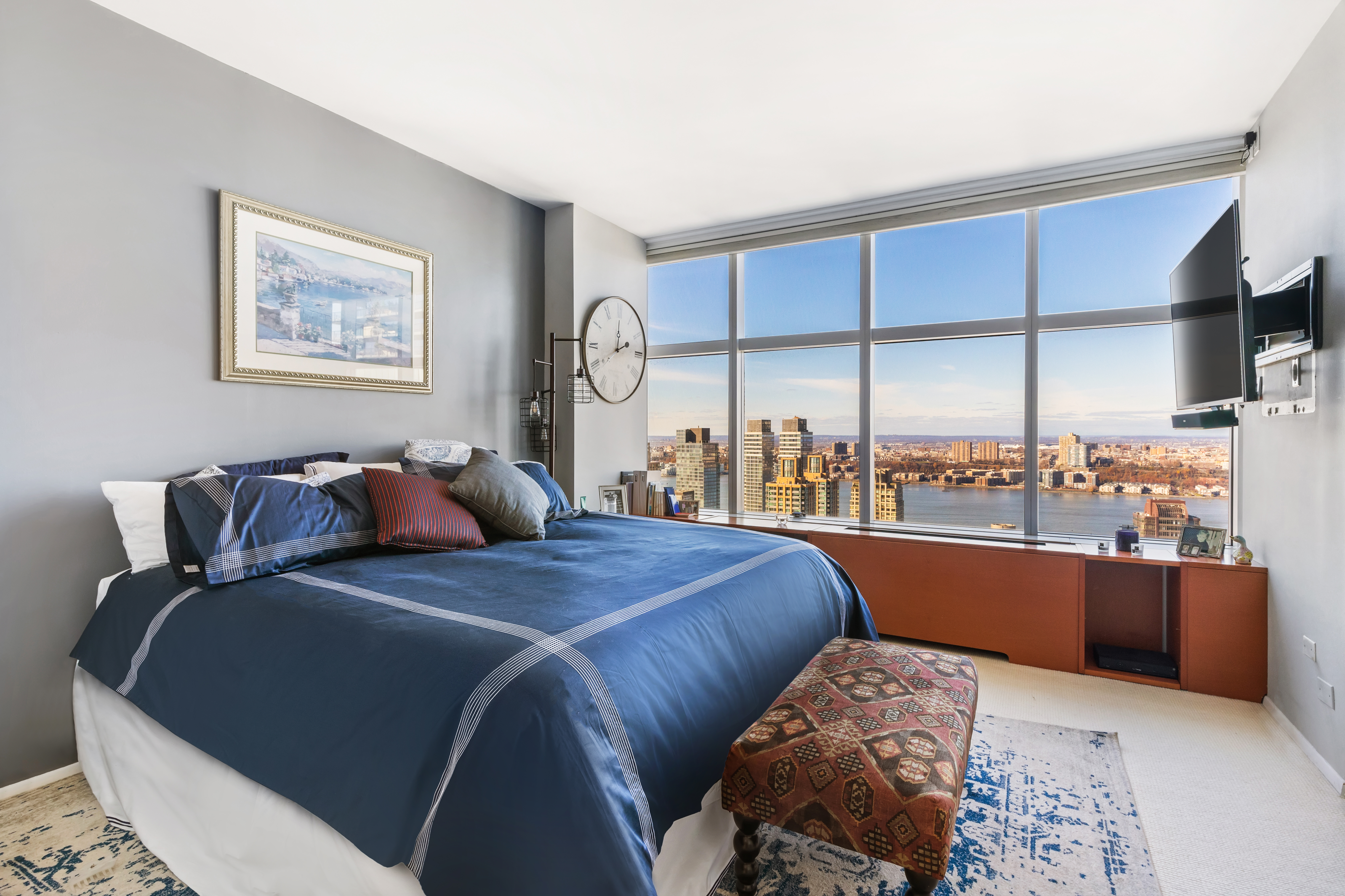 160 West 66th Street, Unit 42AB Manhattan, NY 10023 - Photo 6 of 15 a bed room with two bed and a large window