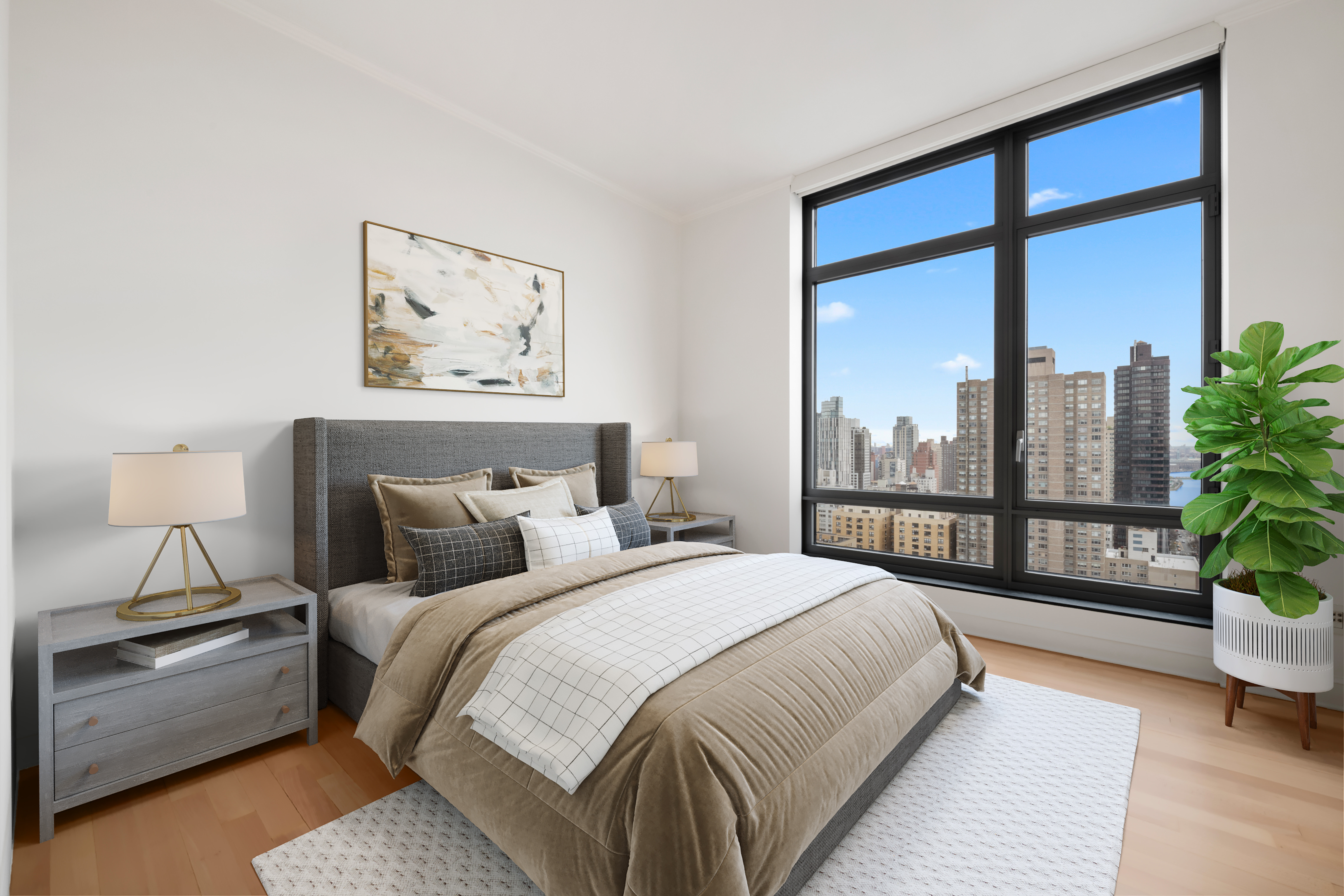 450 East 83rd Street, Unit 23B Manhattan, NY 10028 - Photo 11 of 18 a bedroom with a large bed and a potted plant