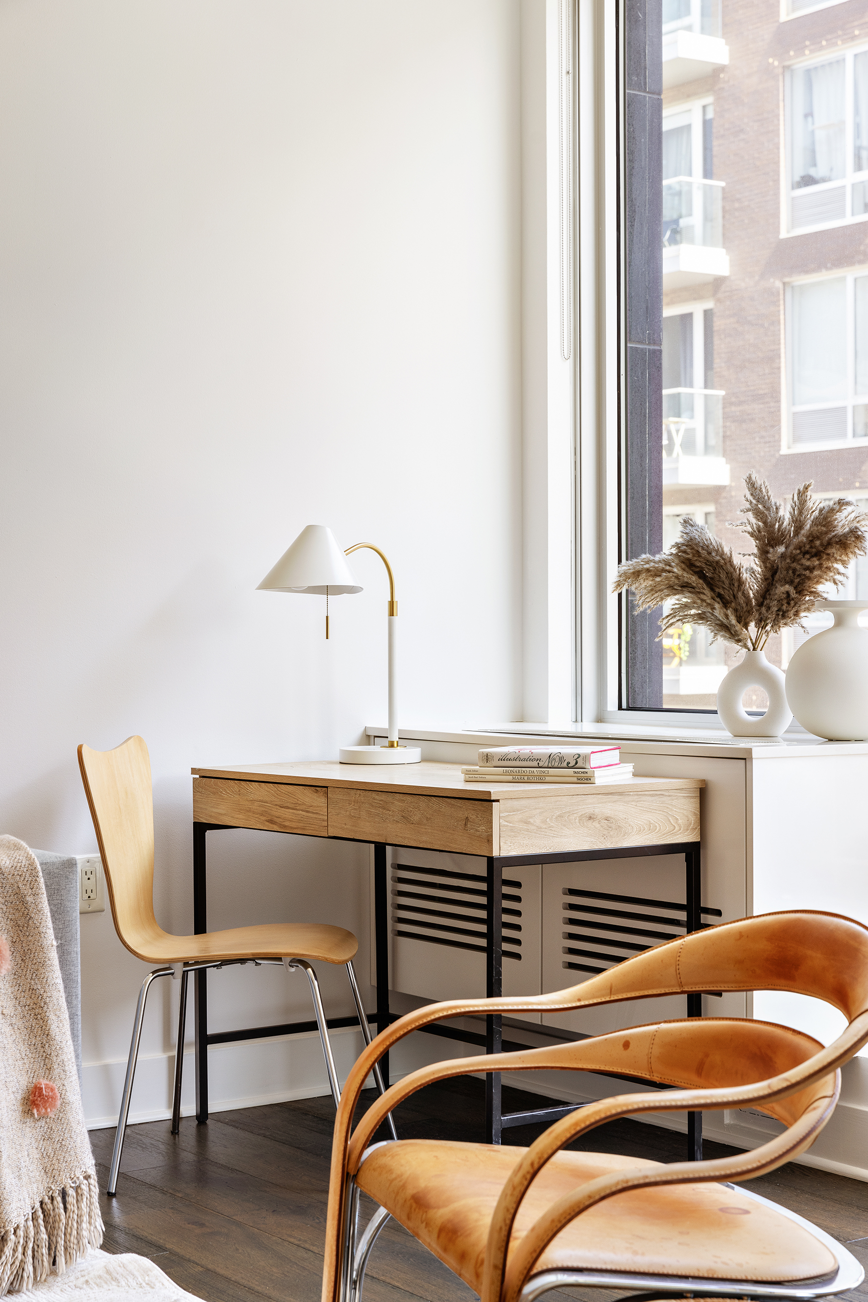 212 North 9th Street, Unit 3C Brooklyn, NY 11211 - Photo 2 of 16 a bedroom with a bed and a chair