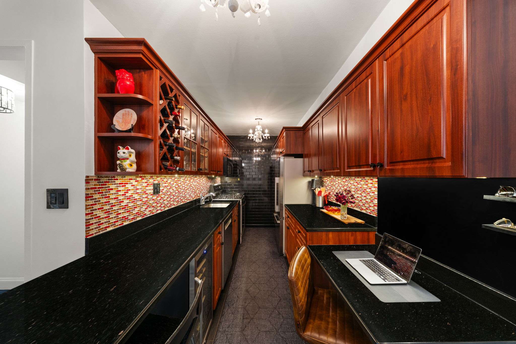 310 Lexington Avenue, Unit 2J Manhattan, NY 10016 - Photo 7 of 11 a view of a kitchen with stainless steel appliances granite countertop a stove and a refrigerator