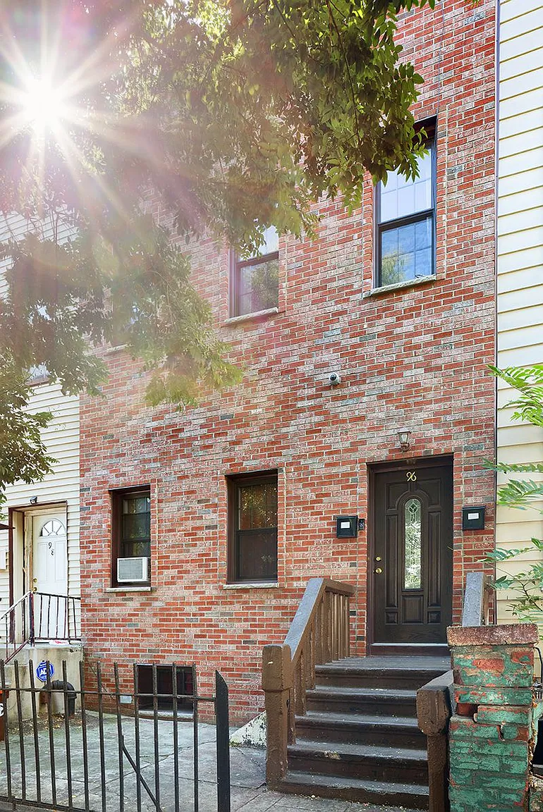 96 Sackman Street Brooklyn, NY 11233 - Photo 2 of 10 a view of a brick house with a large windows